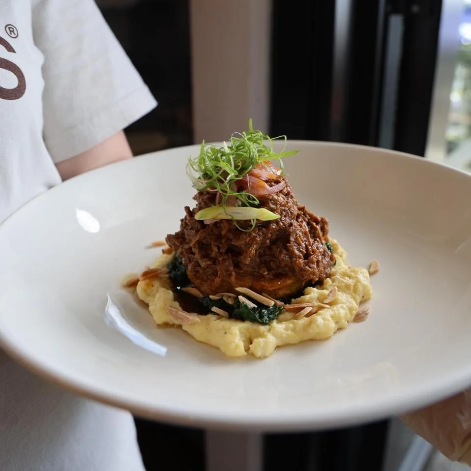 Have you tried out this delicious meal? 

Northwest Lamb is a Boston Signature Dish
Featuring shredded slow cooked lamb legs, pickled onion, baby spinach, creamy Italian polenta, finely chopped spring onion and toasted almonds served with a potato Ro