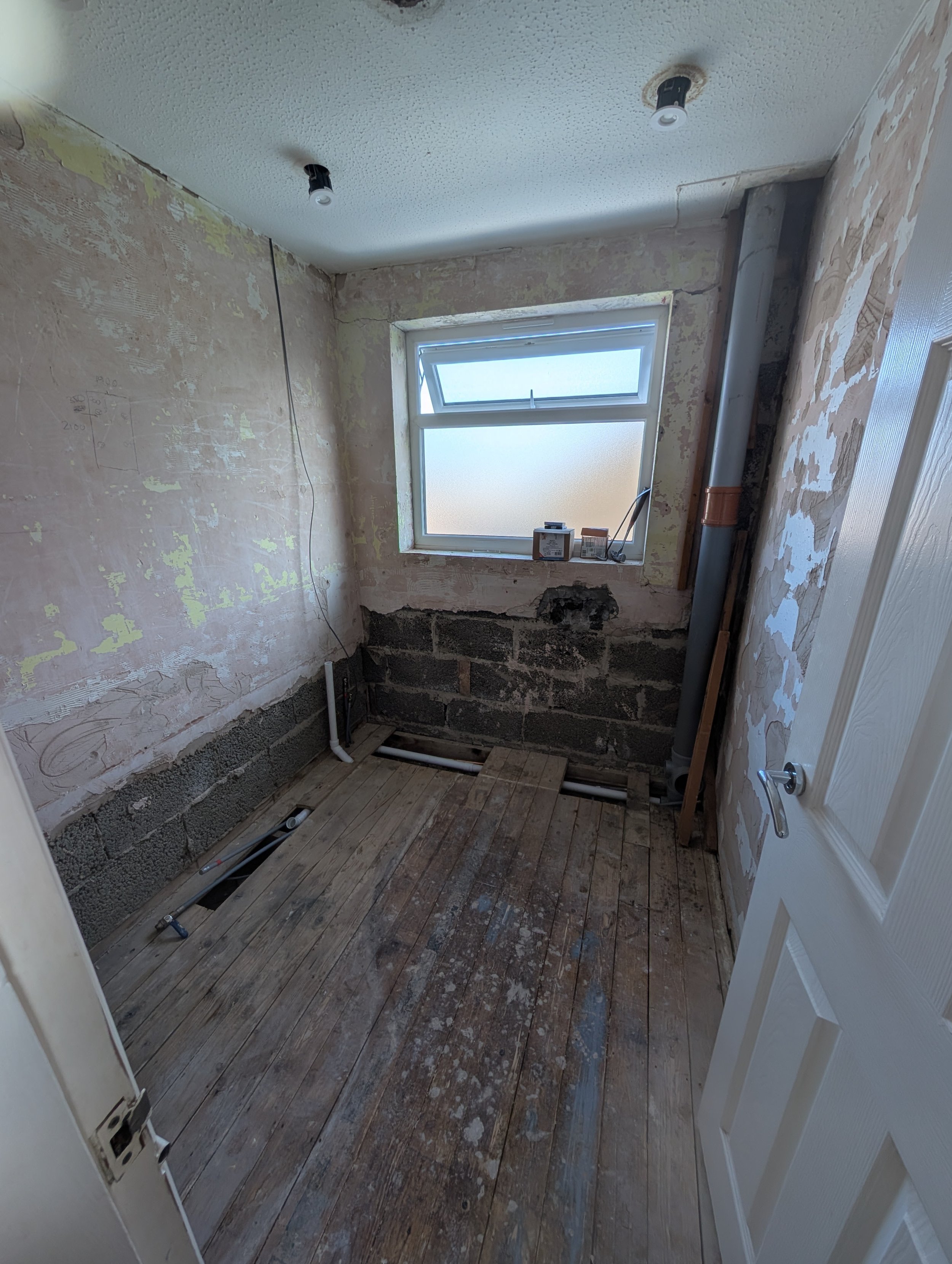 Full rip-out, back to bare bones to make the necessary pipework adjustments - new downlights also fitted