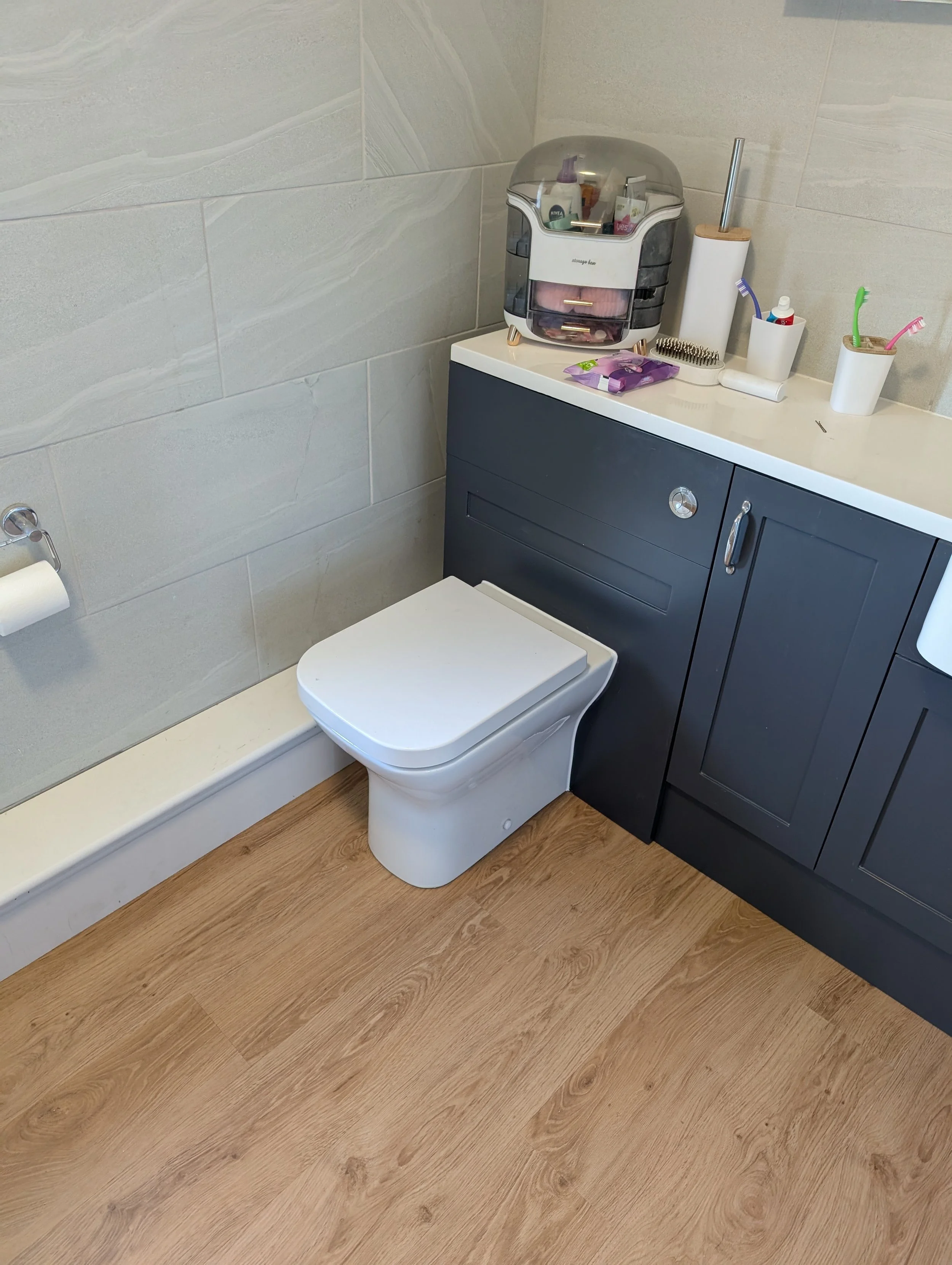 LVT click flooring for the bathroom with new skirting, boxing and bath panel all to match