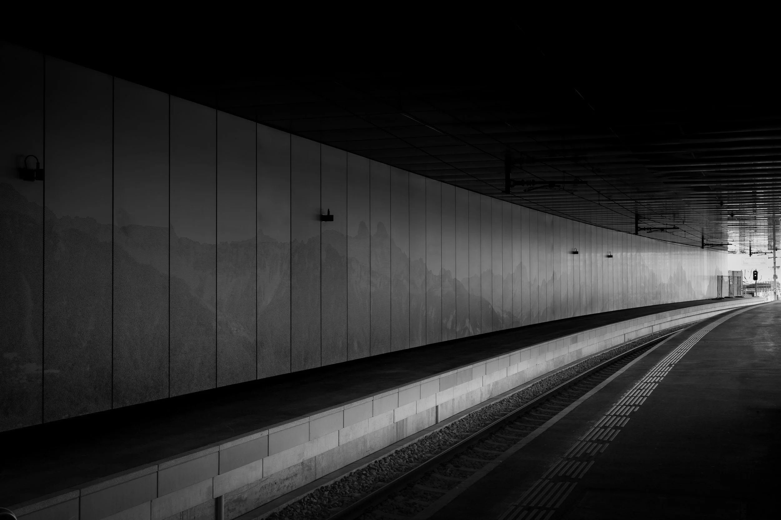 Black and white photo of a railway platform