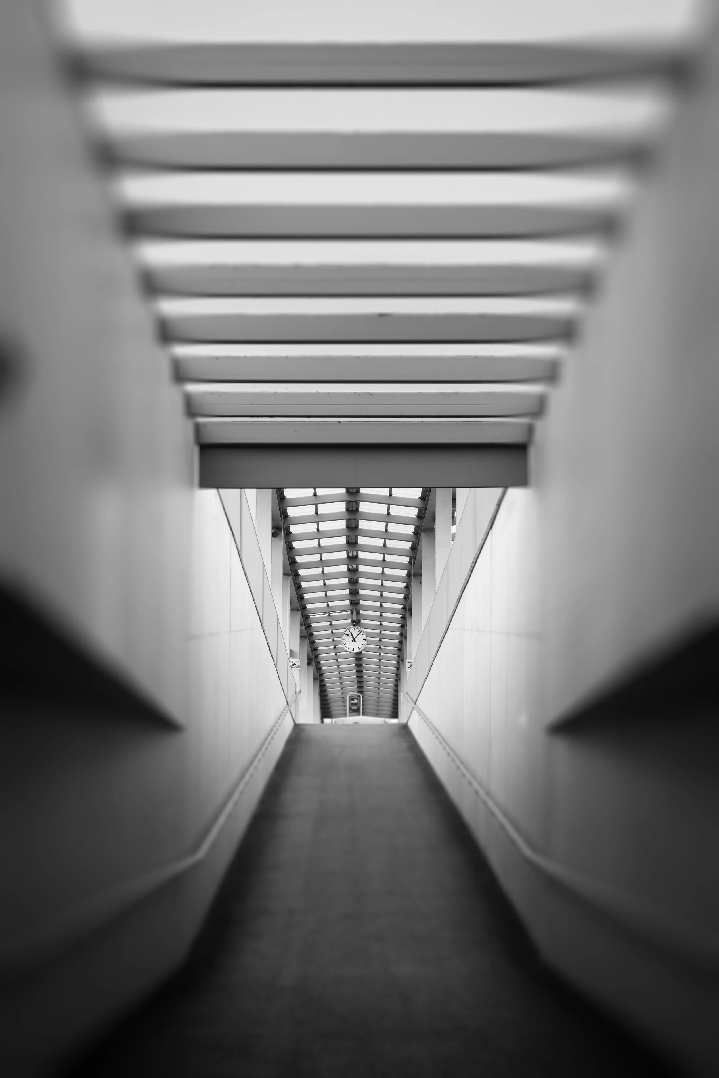 Black and white photograph of an empty railway ramp