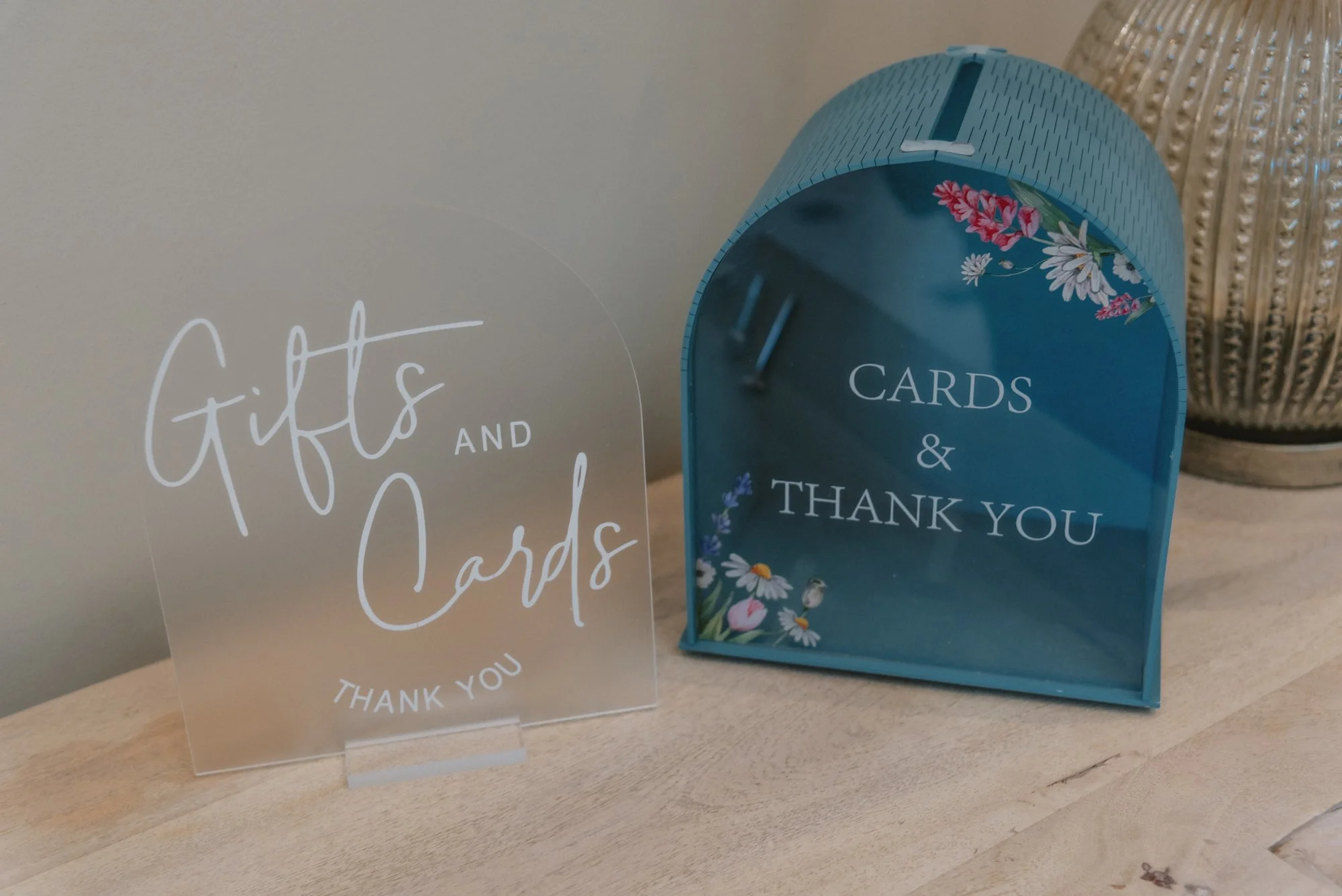 Decorative sign and box for gifts, cards, and thank you notes on a wooden surface.