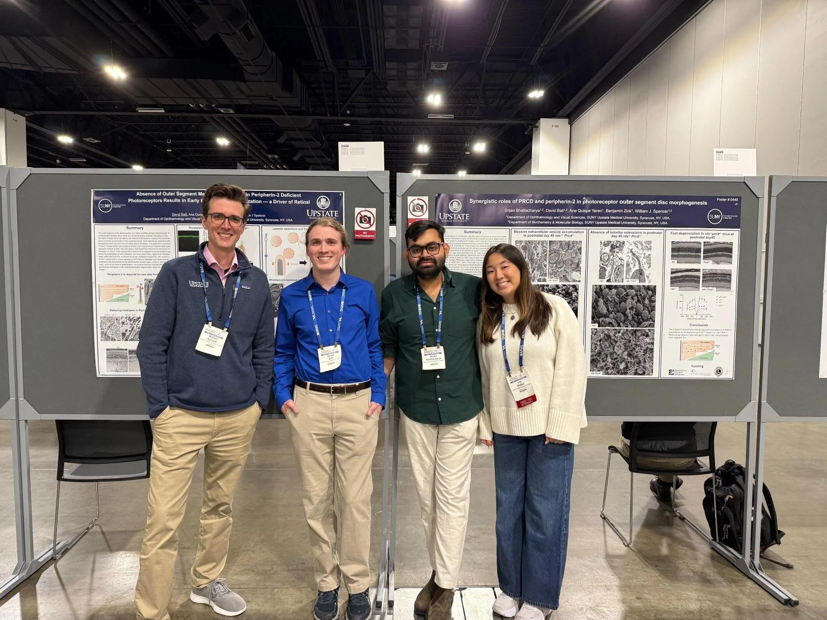 David and Srijan at their posters with Will and Lily.