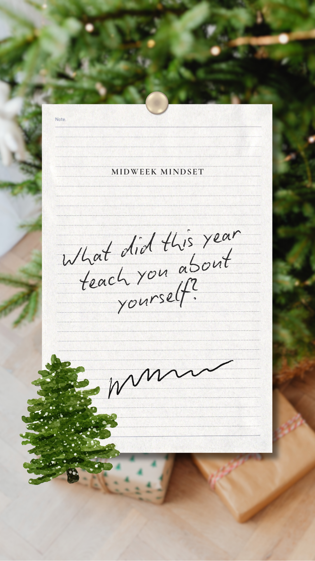 A note titled 'Midweek Mindset' handwritten on lined paper with a small green Christmas tree illustration at the bottom left corner. The note asks, 'What did this year teach you about yourself?' The paper is pinned on a Christmas tree with presents visible at the bottom of the image.