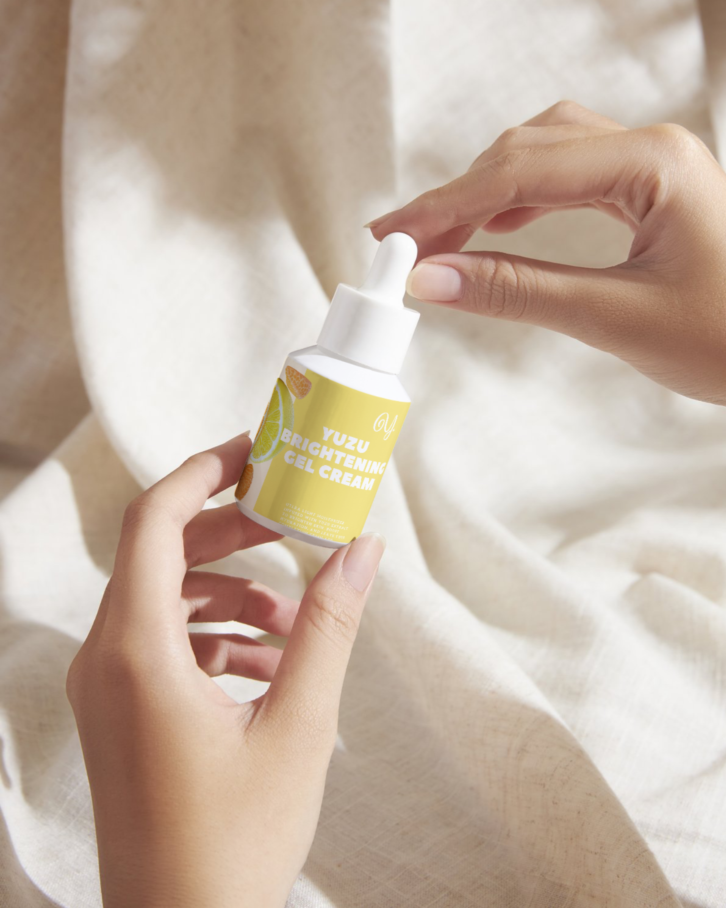 Yuzu Brightening Gel Cream skincare packaging featuring citrus ingredient illustrations.