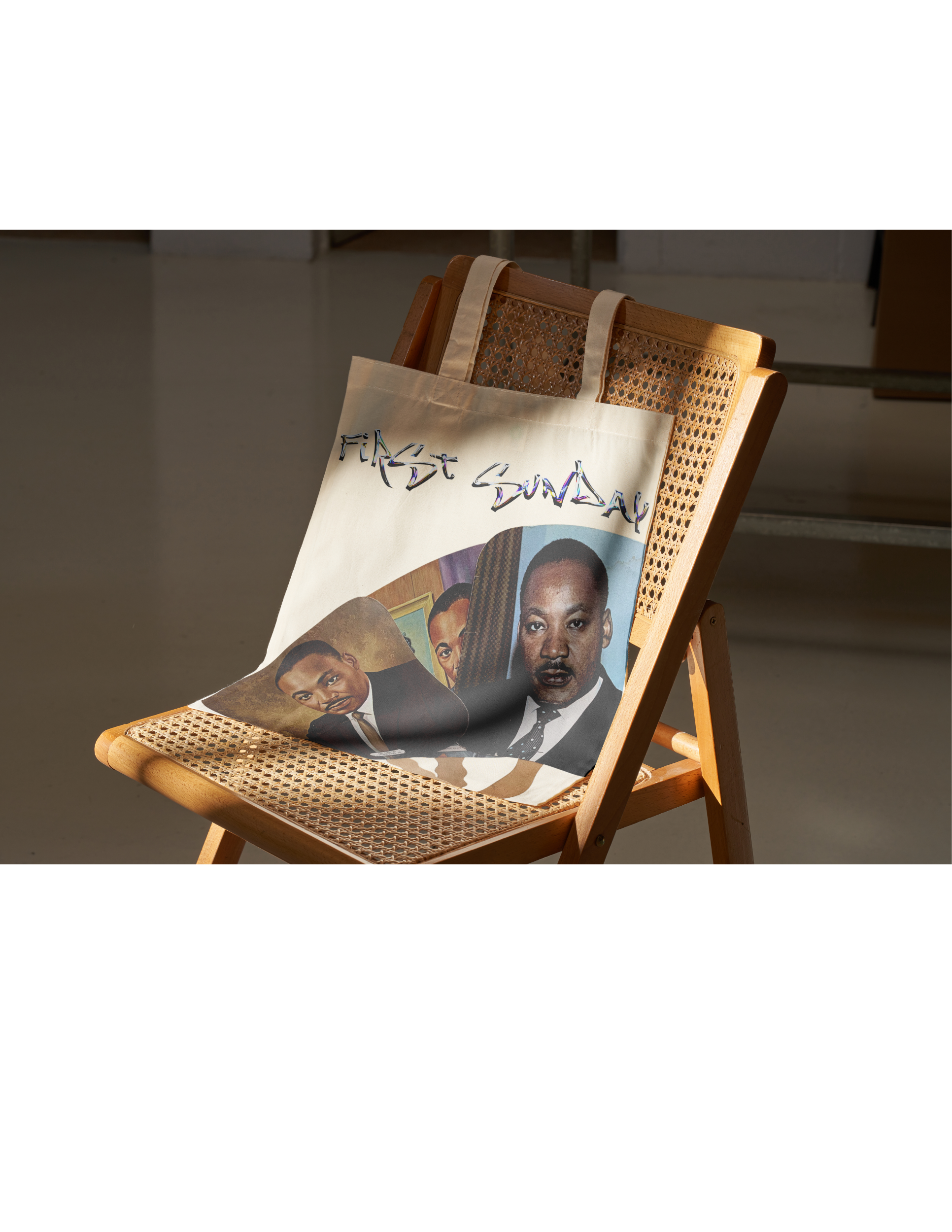 Lifestyle tote bag product mockup featuring a collage portrait design printed on canvas, displayed on a wooden chair with woven cane backing.