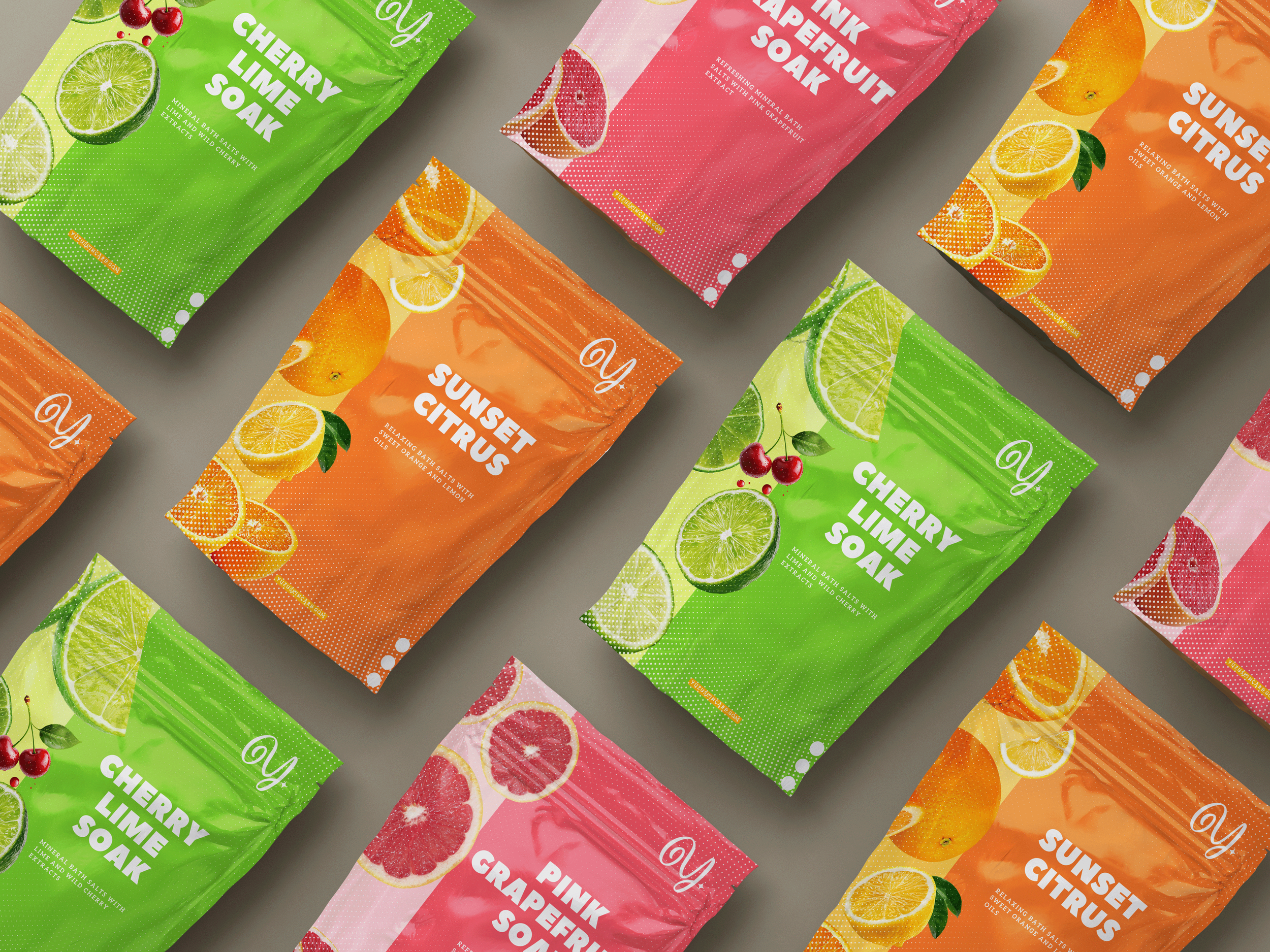 Colorful fruit-inspired bath salt packaging designs featuring flavors like Cherry Lime, Sunset Citrus, and Pink Grapefruit arranged as a lifestyle product display.