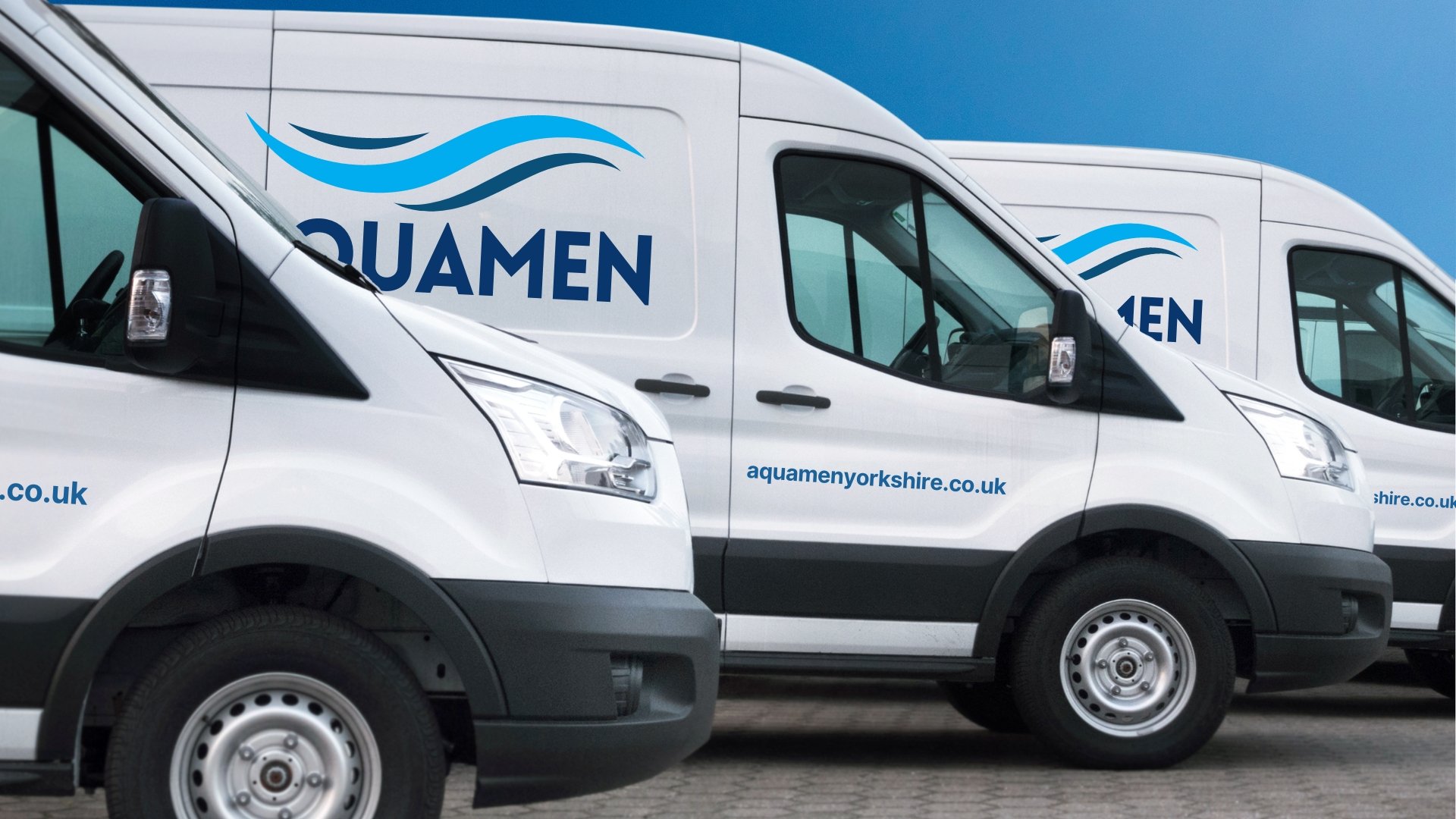 A fleet of white delivery trucks with 'Aquamen' branding, featuring blue wave logo and website aquamenyorkshire.co.uk, parked on a paved surface against a blue sky.