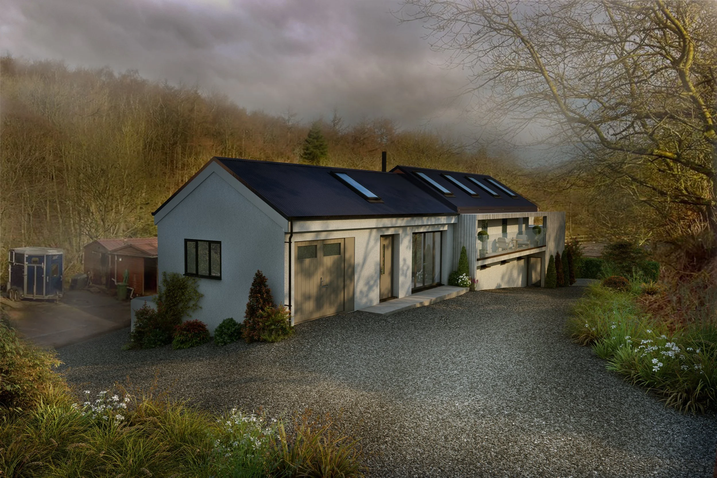 Modern two-story house with gray and wood exterior, front driveway, and large glass doors and windows, surrounded by greenery and trees in a rural setting.