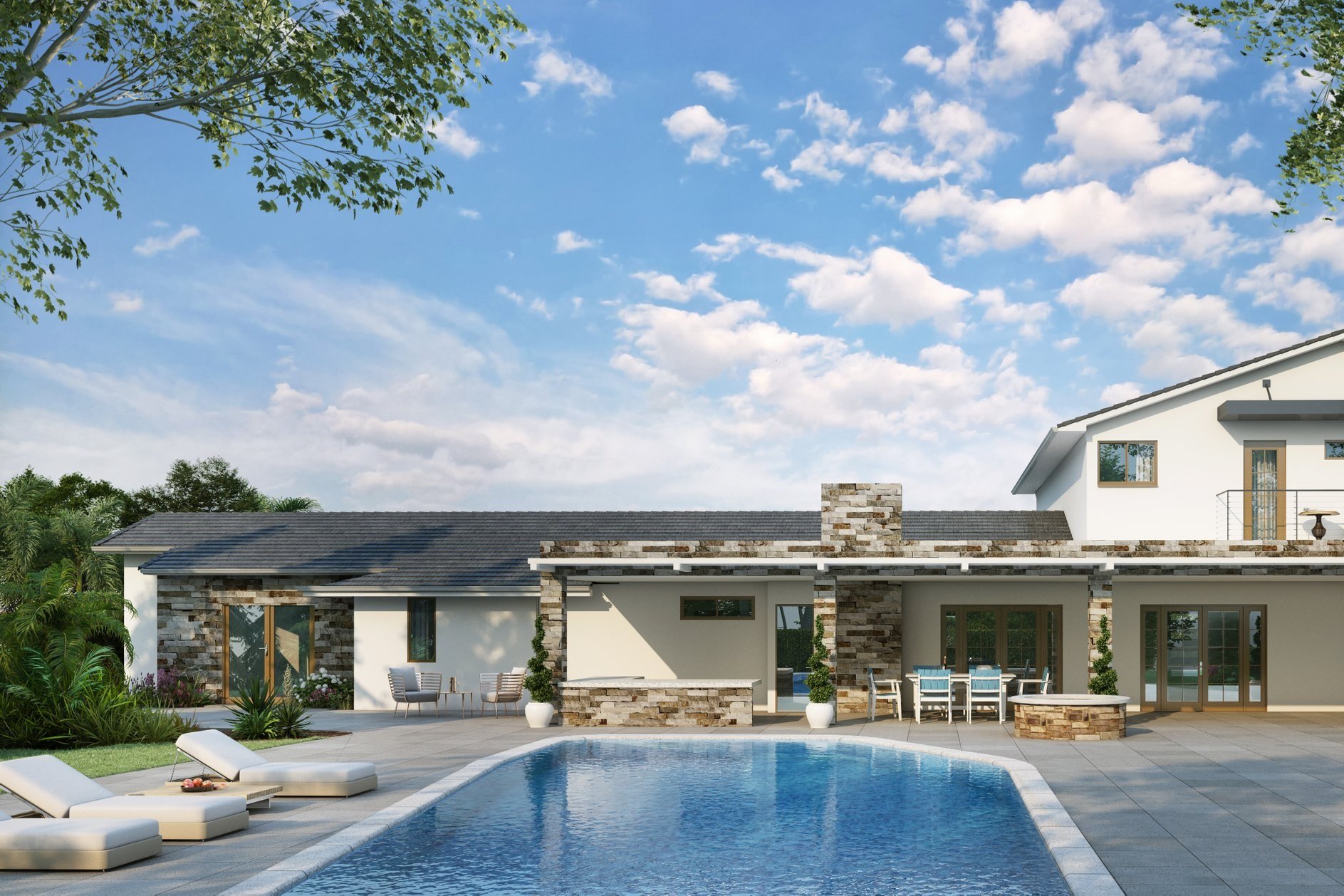 Modern backyard with a swimming pool, lounge chairs, patio furniture, and a house with a stone and white exterior under a blue sky with clouds.
