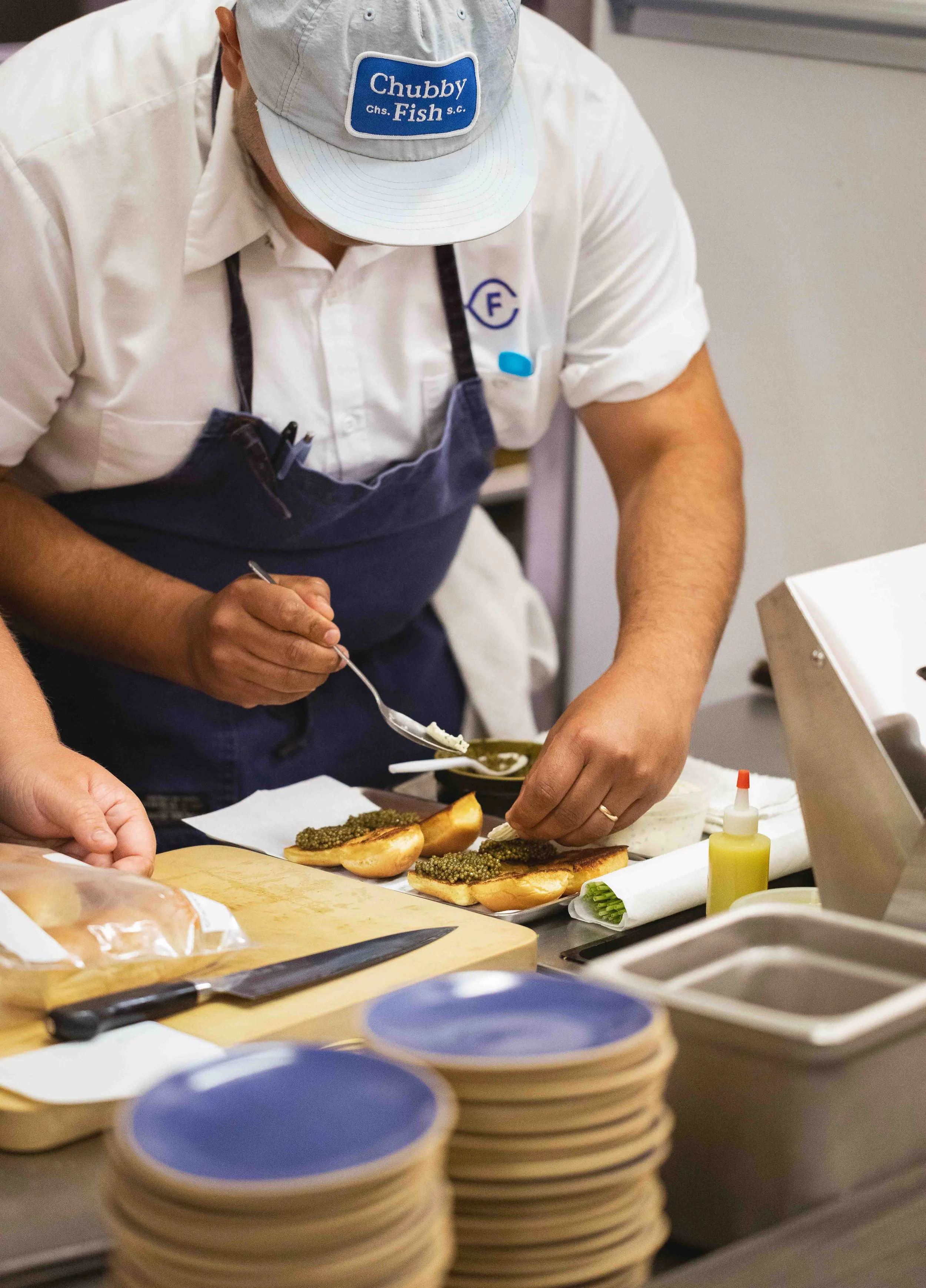 Kitchen shots for guest chef collaboration with James London of Chubby Fish at Daniel Humm x The Charleston Place popup powered by Resy. Food and lifestyle photography for Daniel Humm x The Charleston Place in Charleston, South Carolina.

Studio Lou 
