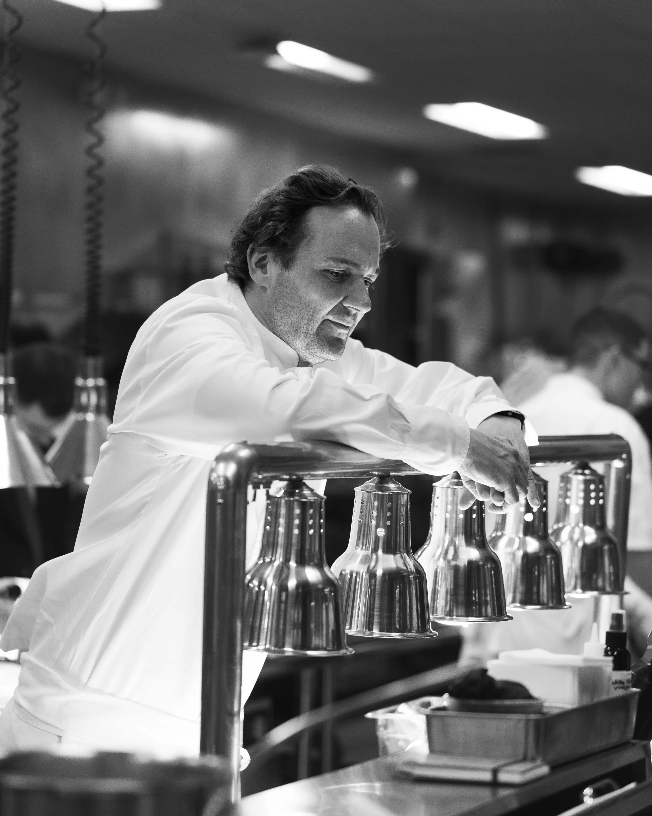 Chef Daniel Humm in the kitchen for guest chef collaboration with Sean Brock at Daniel Humm x The Charleston Place popup powered by Resy. Food and lifestyle photography for Daniel Humm x The Charleston Place in Charleston, South Carolina.

Studio Lou