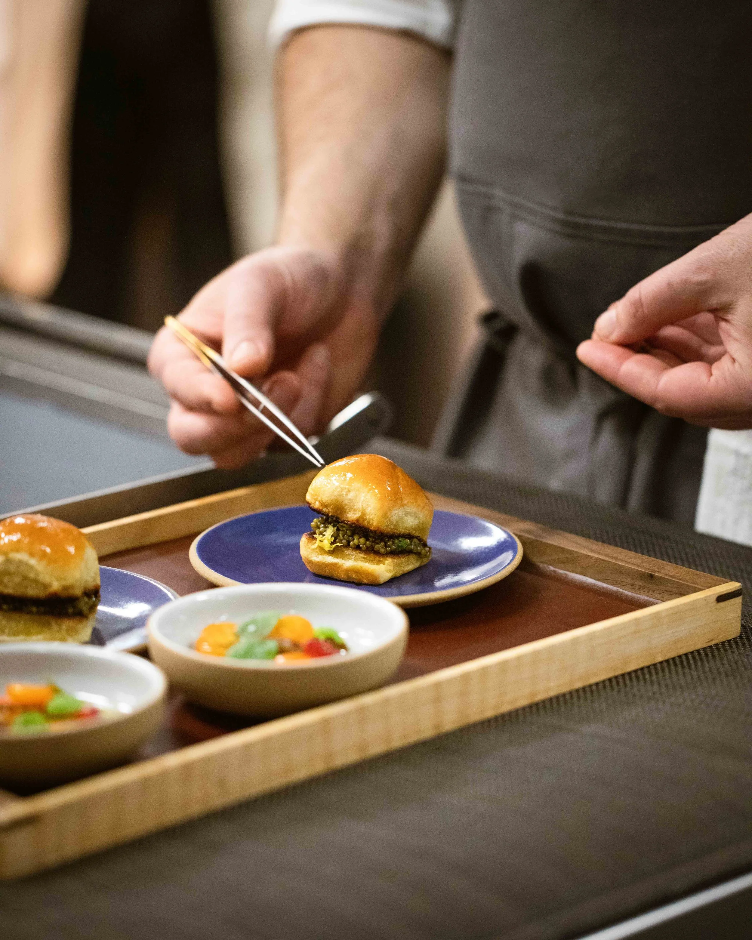 Kitchen shots for guest chef collaboration with James London of Chubby Fish at Daniel Humm x The Charleston Place popup powered by Resy. Food and lifestyle photography for Daniel Humm x The Charleston Place in Charleston, South Carolina.

Studio Lou 