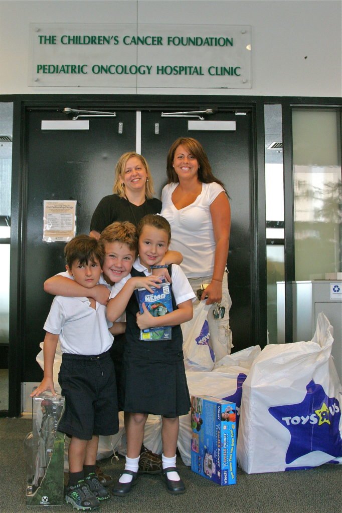 2007-first-visit-to-Johns-hopkins-Oncology-Floor-with-presents--682x1024.jpg
