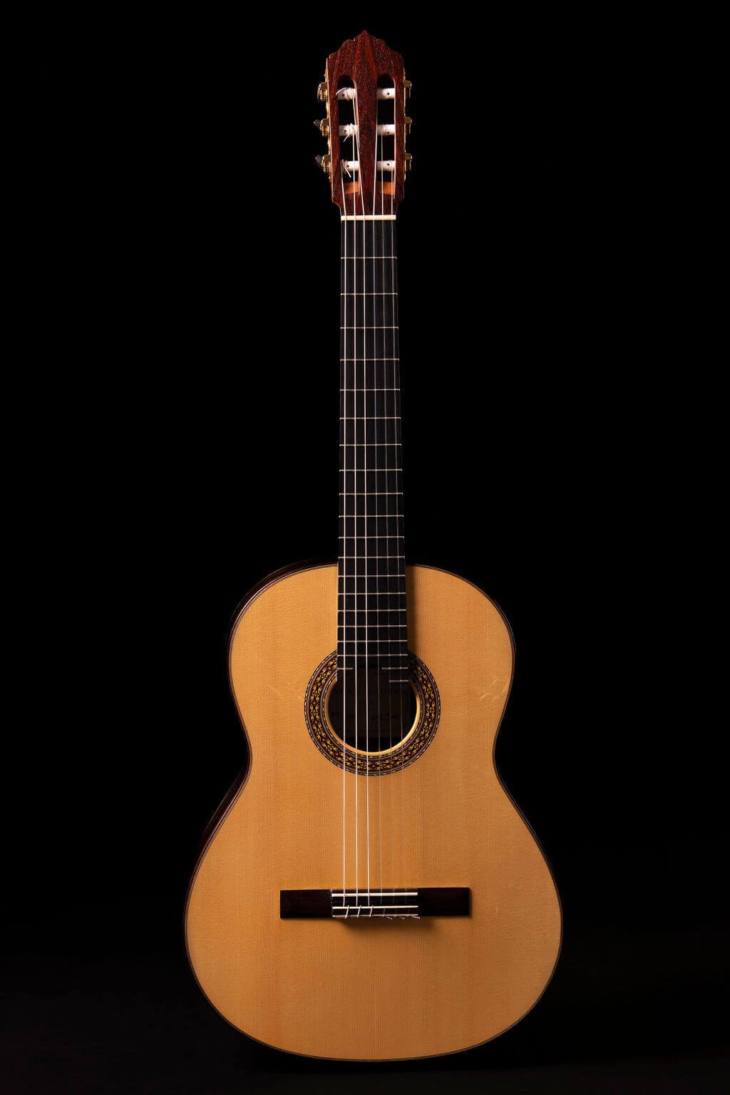 Front view of guitar with an Engelmann Spruce top, ebony fretboard, and Gotoh tuners