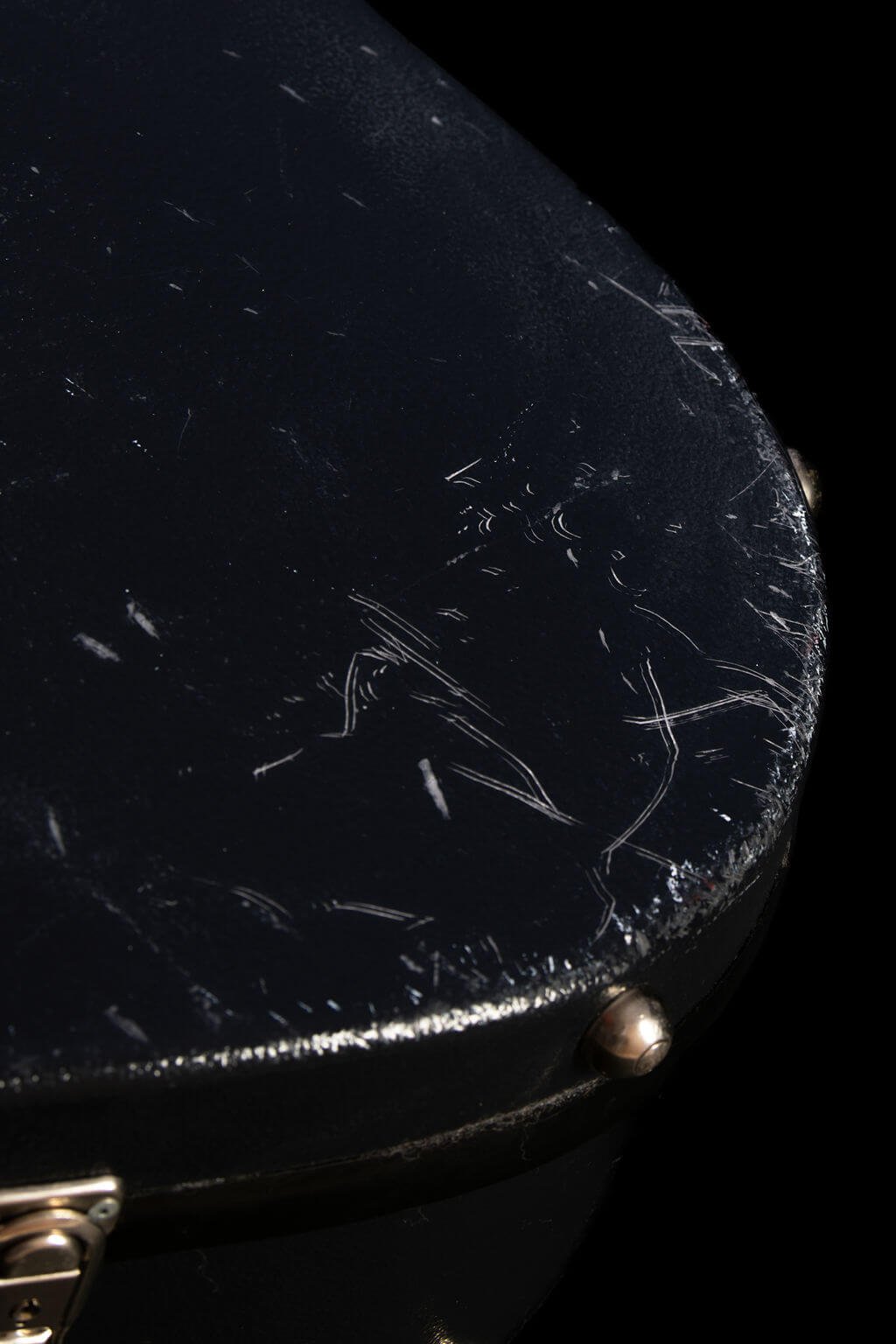Closeup of scratches near the bottom of a black Clarton flight case