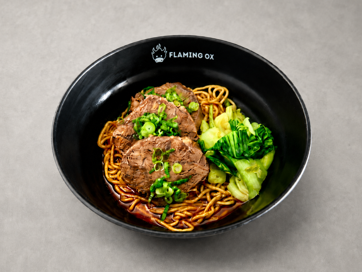 Traditional Dry Beef Noodle with tender beef shank, chewy noodles, bok choy, scallions, and house chili crisp at Flaming Ox in San Jose.