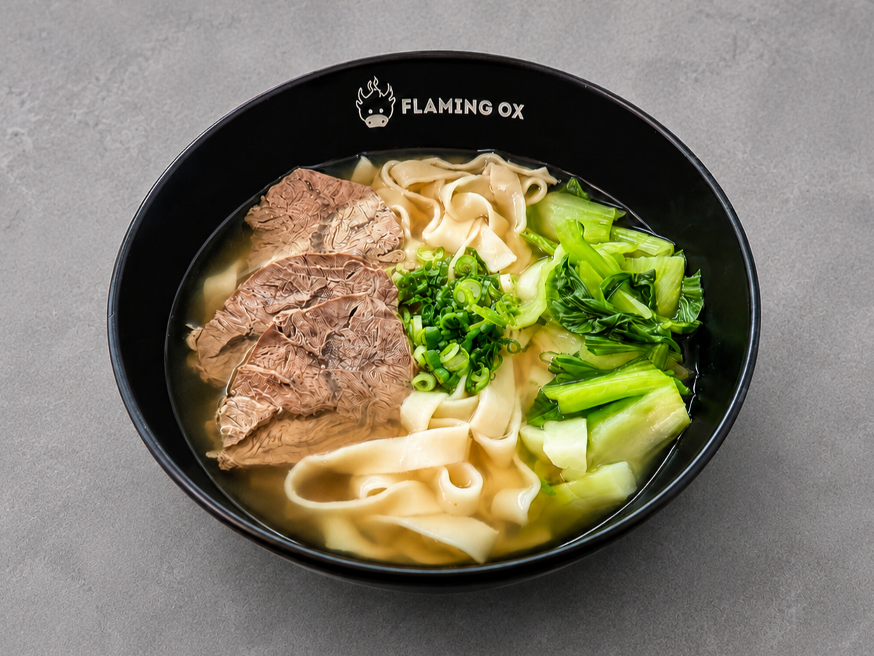 Bone Broth Beef Noodle Soup with beef shank, wide noodles, bok choy, scallions, and clean collagen-rich beef bone broth at Flaming Ox in San Jose.