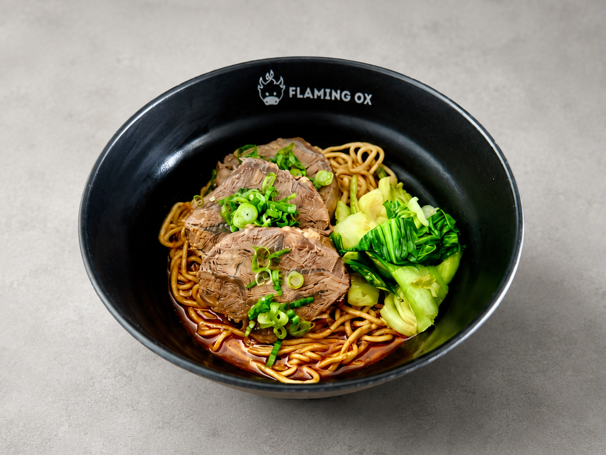Mala Dry Beef Noodle with tender beef shank, chewy noodles, bok choy, scallions, and bold spicy mala sauce at Flaming Ox in San Jose.