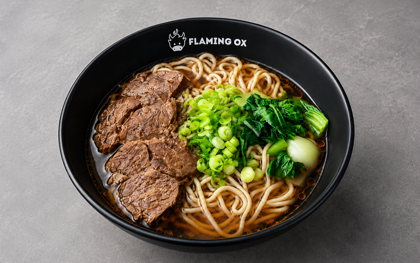 Traditional Beef Noodle Soup with tender beef shank, noodles, bok choy, scallions, and rich red-braised broth at Flaming Ox in San Jose.