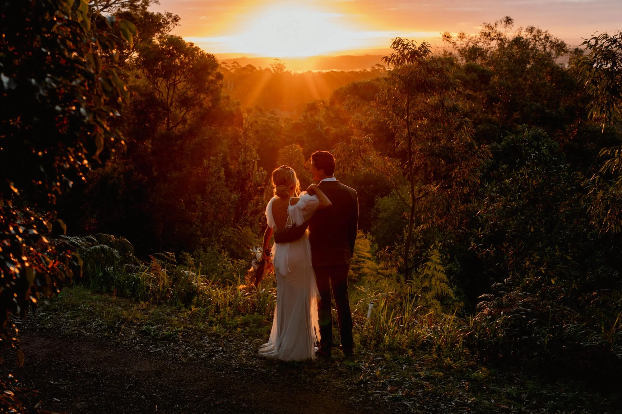 Newly married couple looking at the sunset at Sunset+Vine, Bobs Farm, Port Stephens