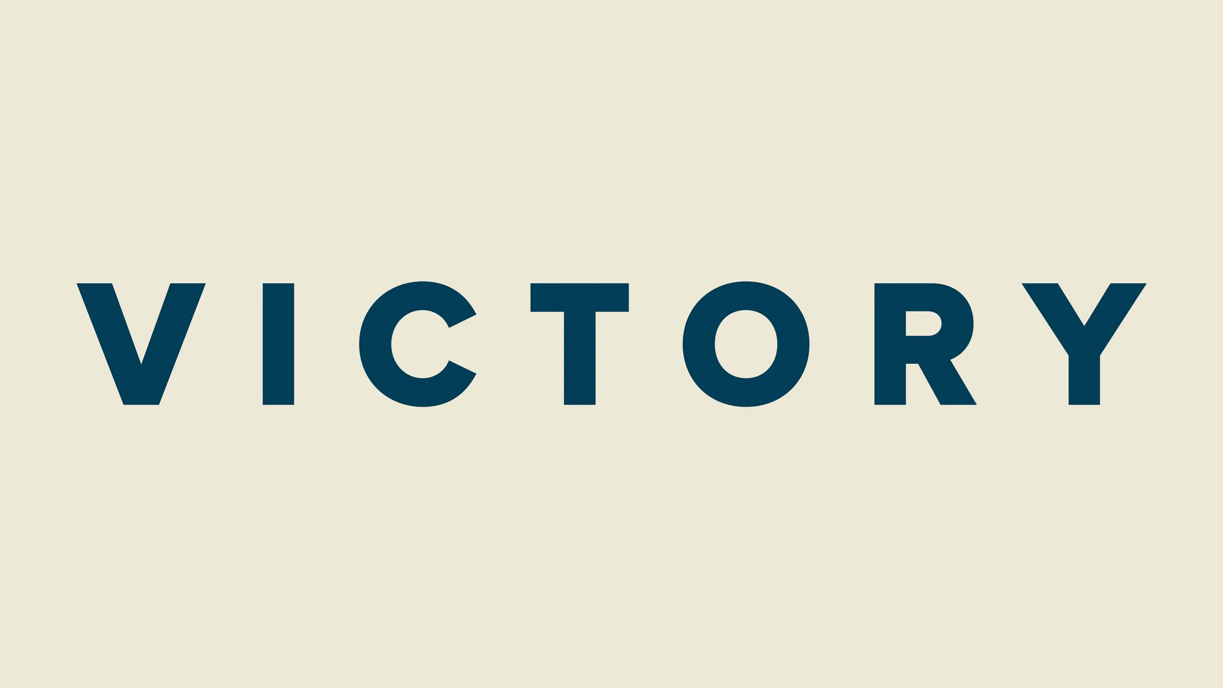The Victory logotype featuring uppercase sans-serif typography in navy on a cream background.