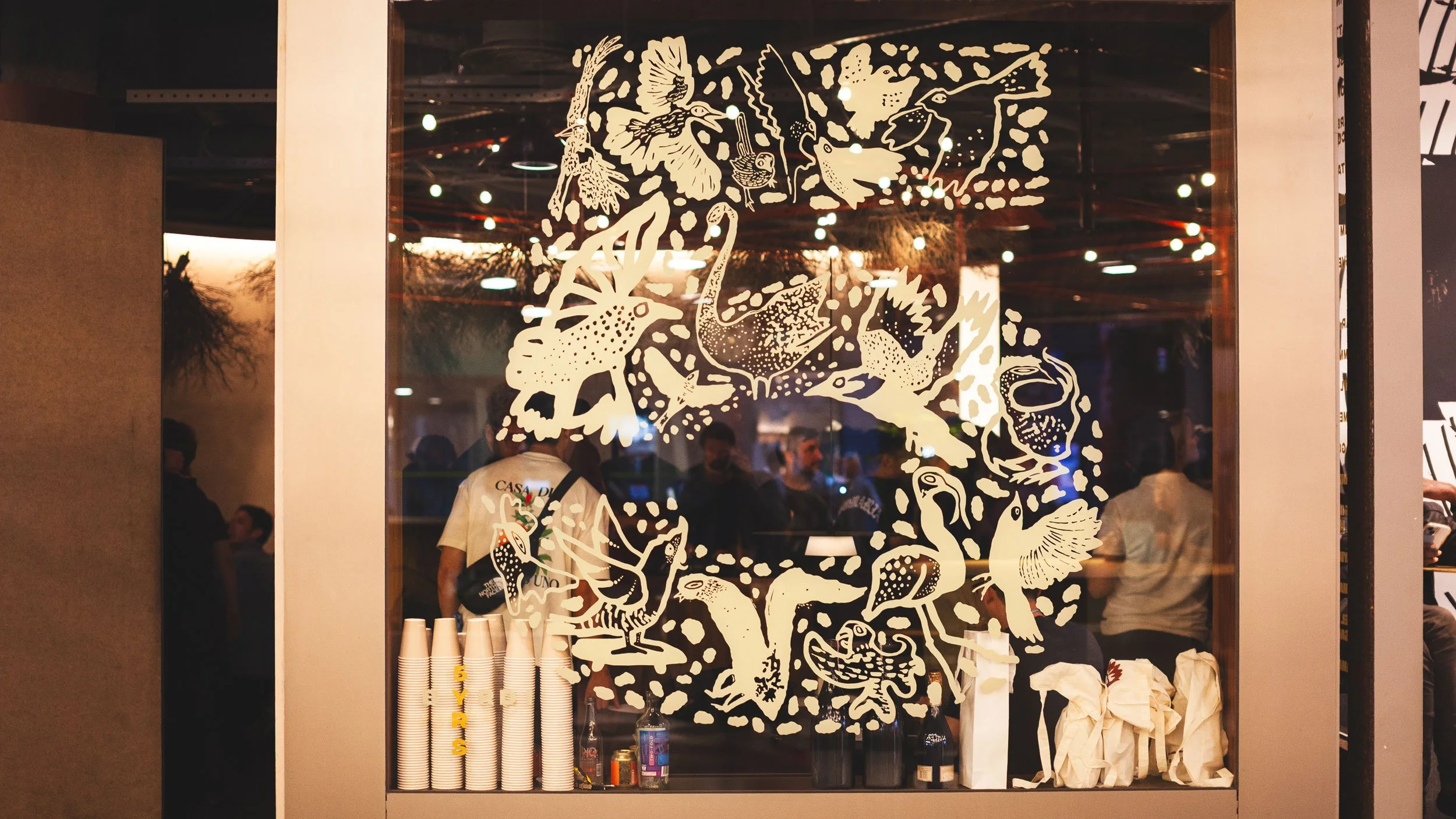 Illustrated birds in a 5 shape applied as a decal on the Byrdi window for their 5th birthday.