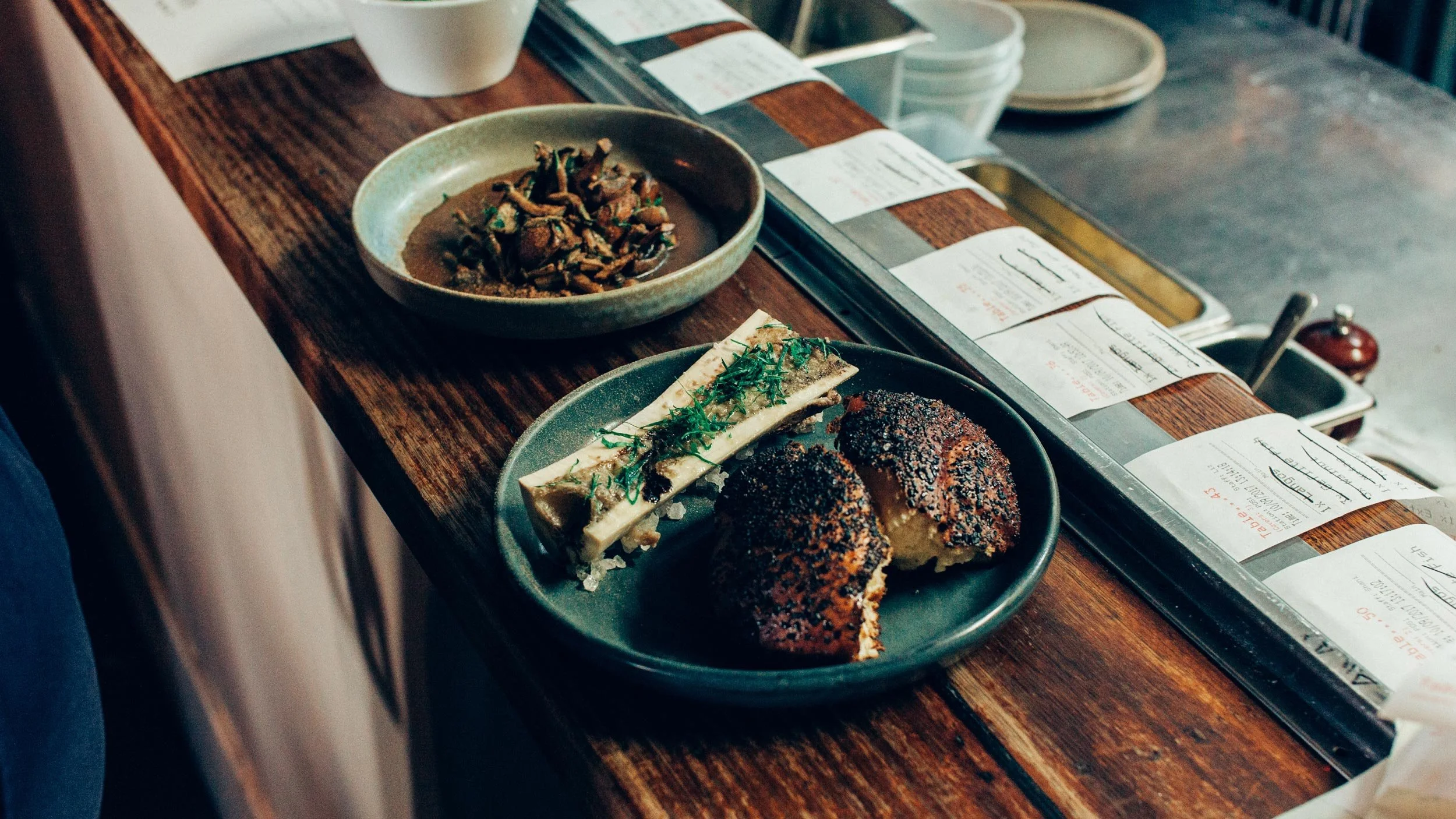 Two dishes on the pass of The Lincoln in Carlton at a Someday Sessions event.