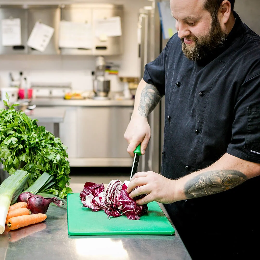 side-view-chef-cutting-red-cabbage.jpg