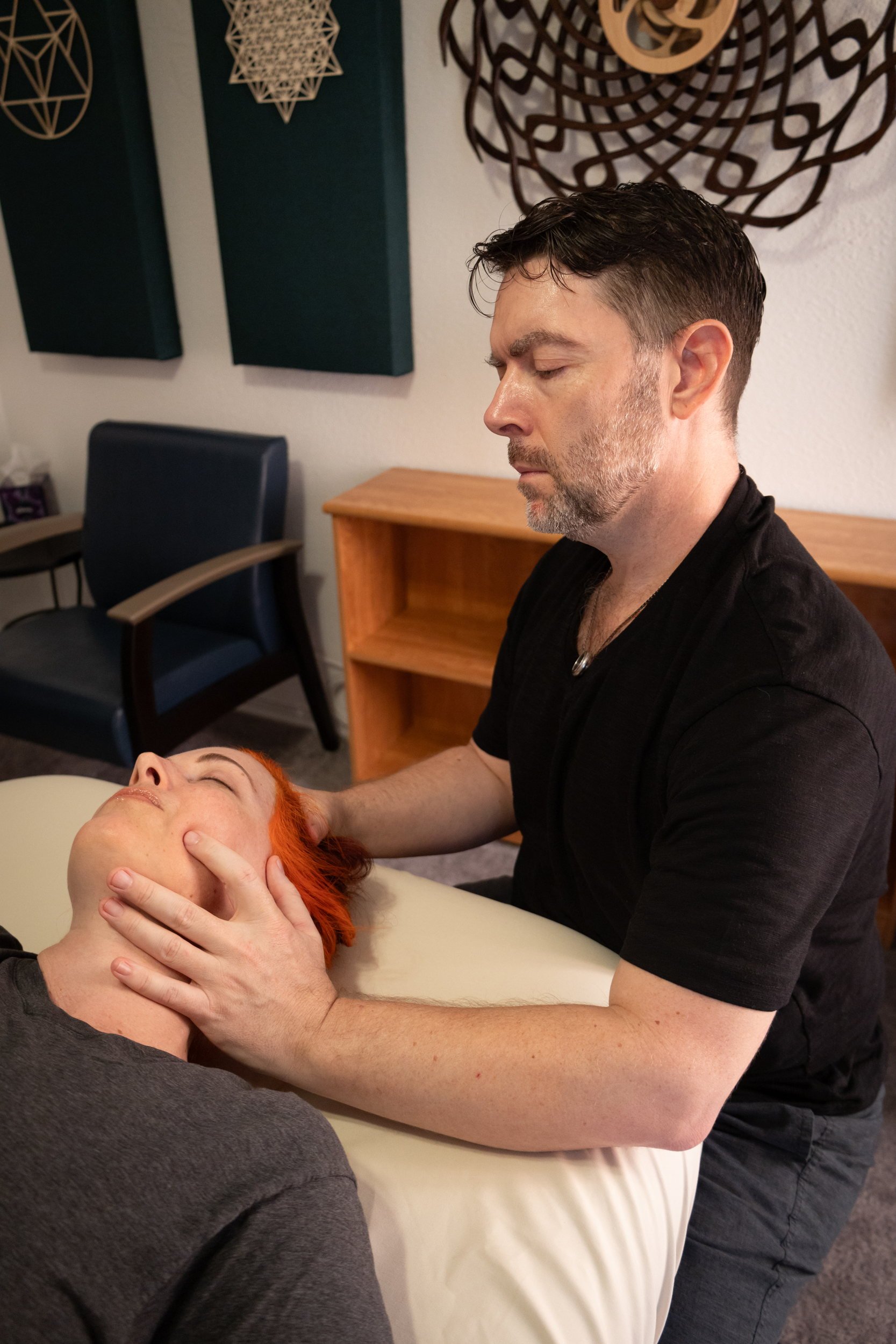 Marty doing delicate work on a client's head and neck