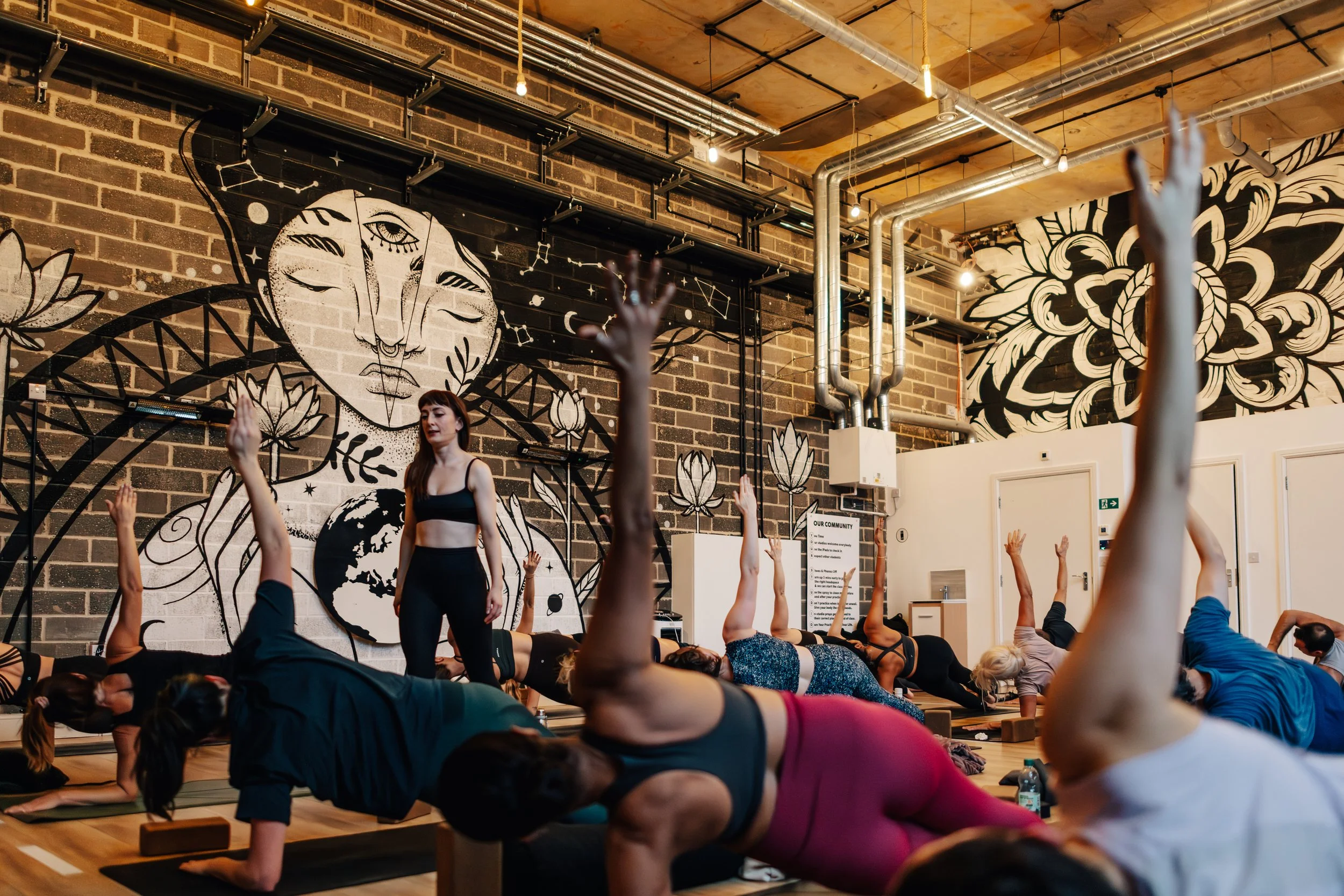 Cally Youdell teaching dynamic corporate yoga class in Manchester