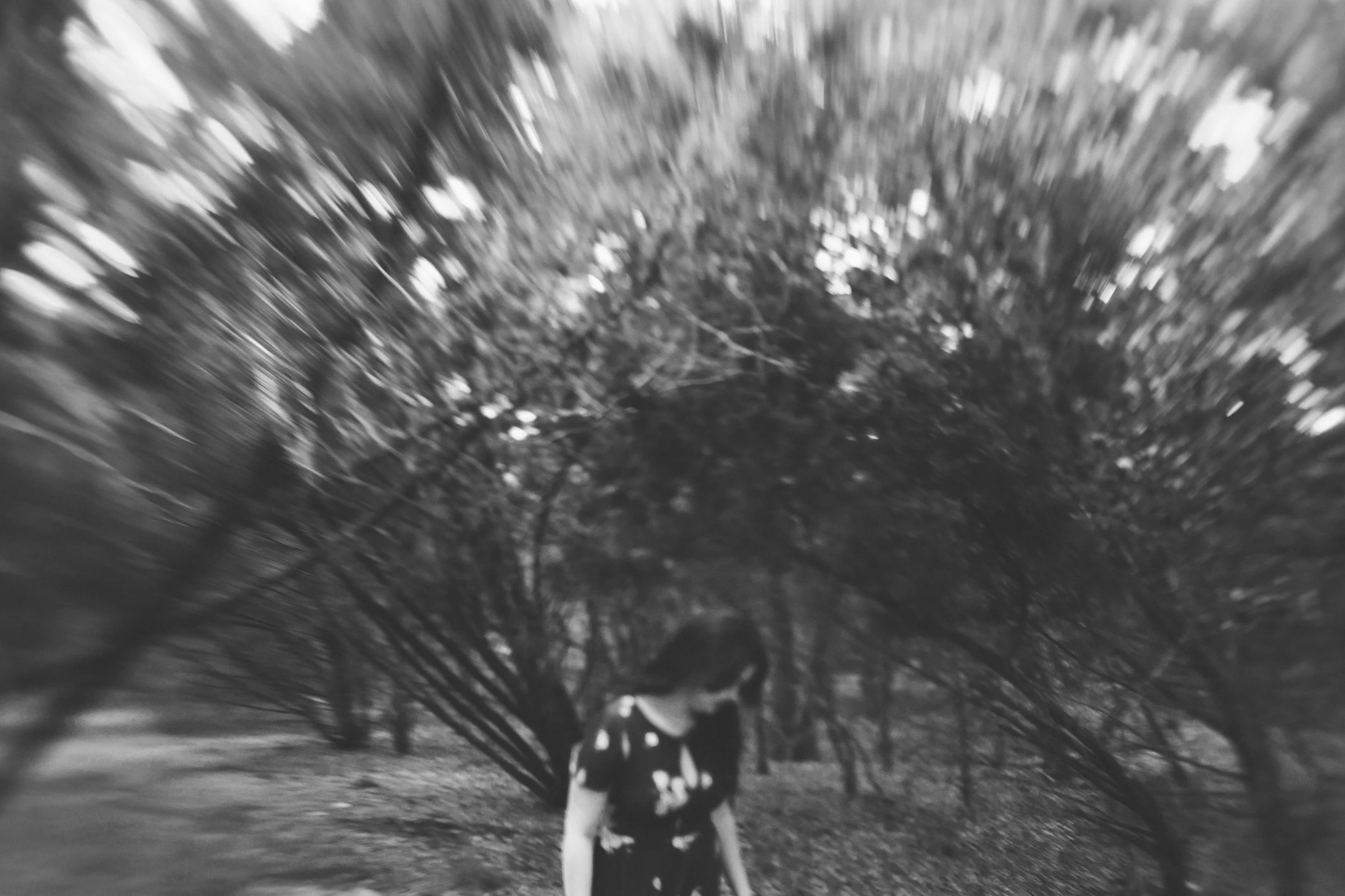 girl+looking+down+in+front+of+treesjpg.jpeg