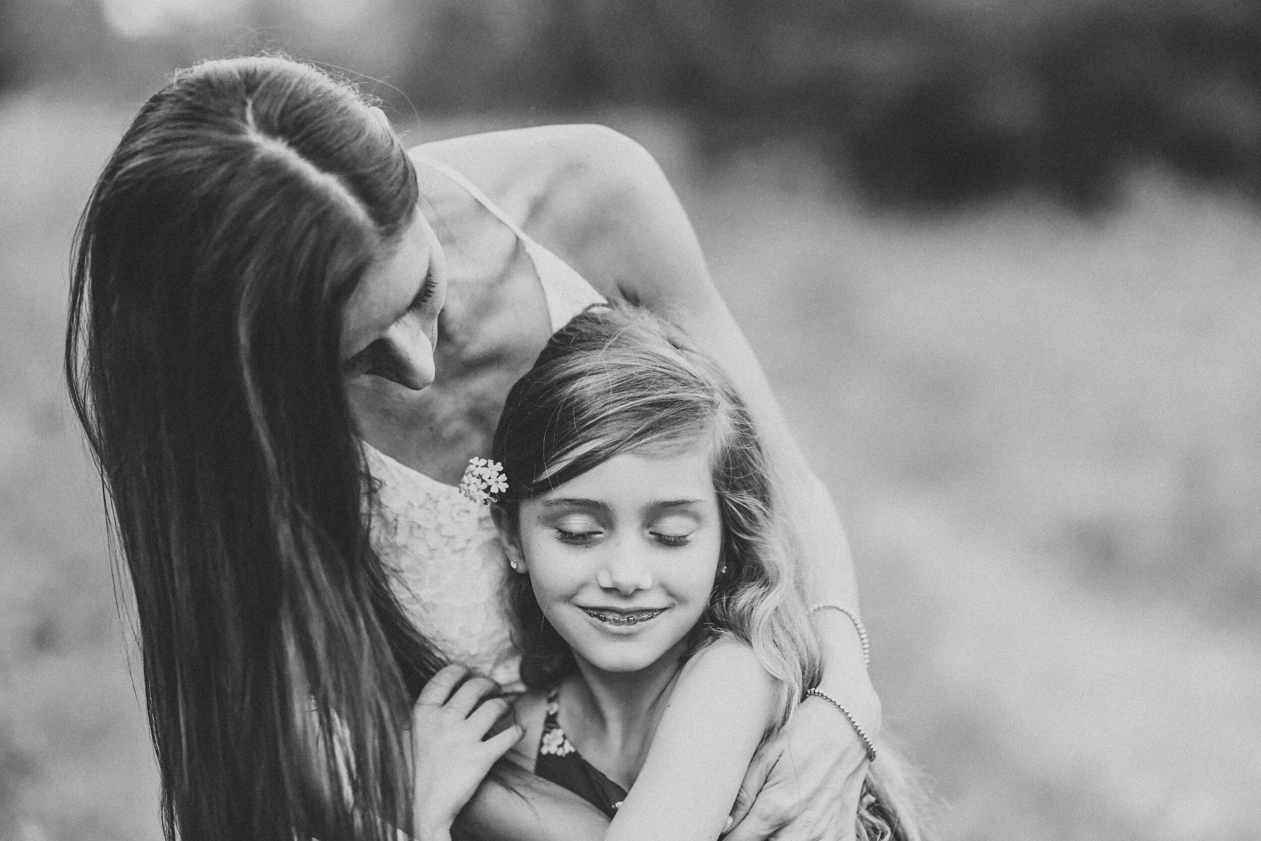mother+looking+over+daughter+Lynn+Walker+Photography.jpeg