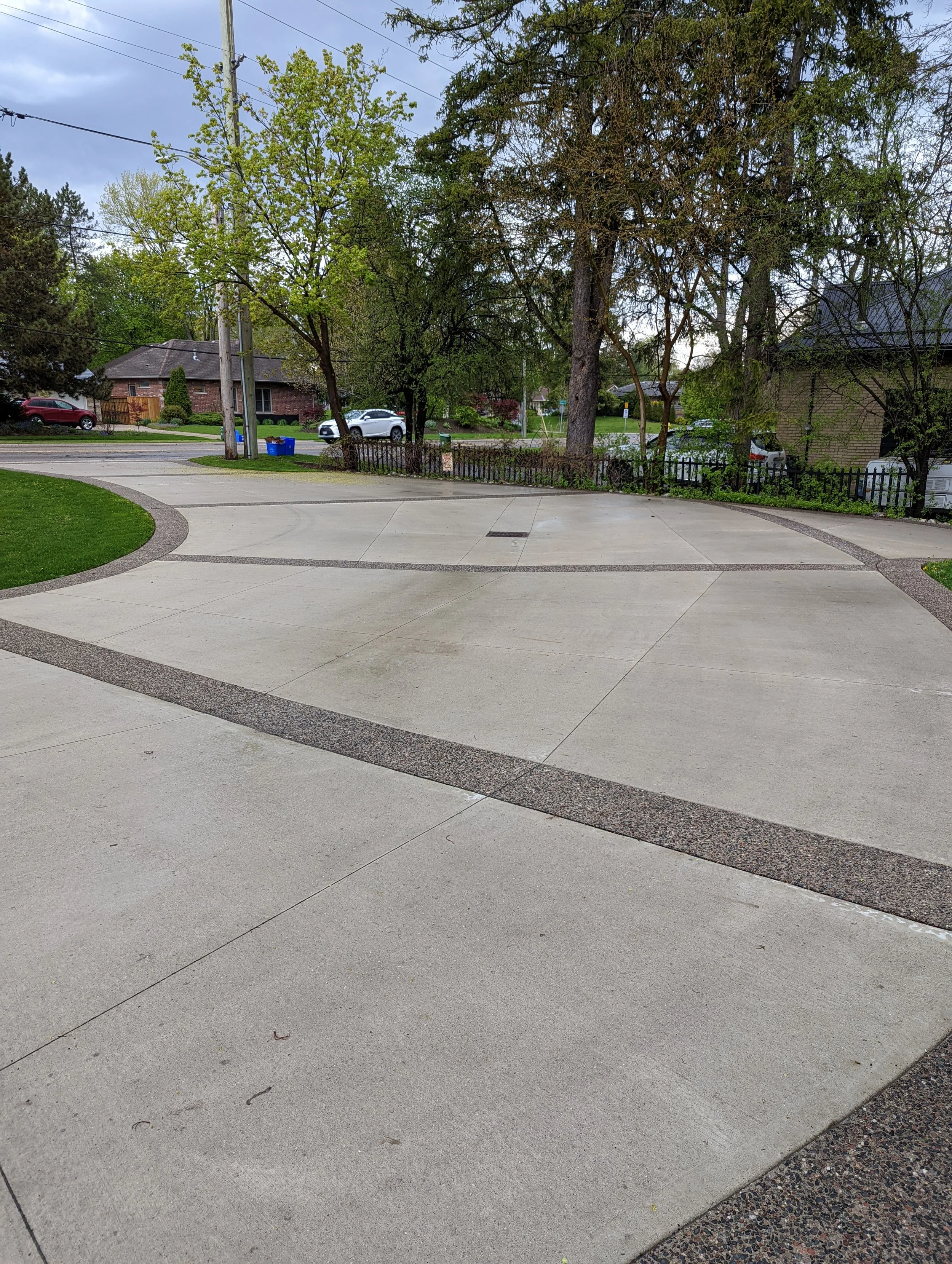broom finish concrete driveway with rocky top borders.jpg