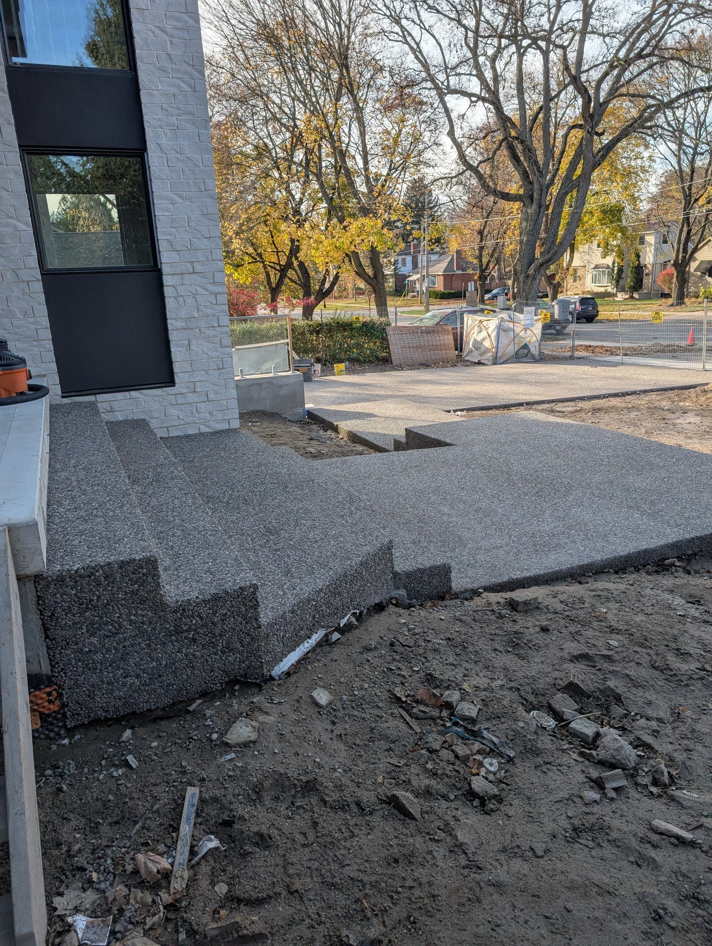 Brown rocky top concrete steps and driveway.jpg