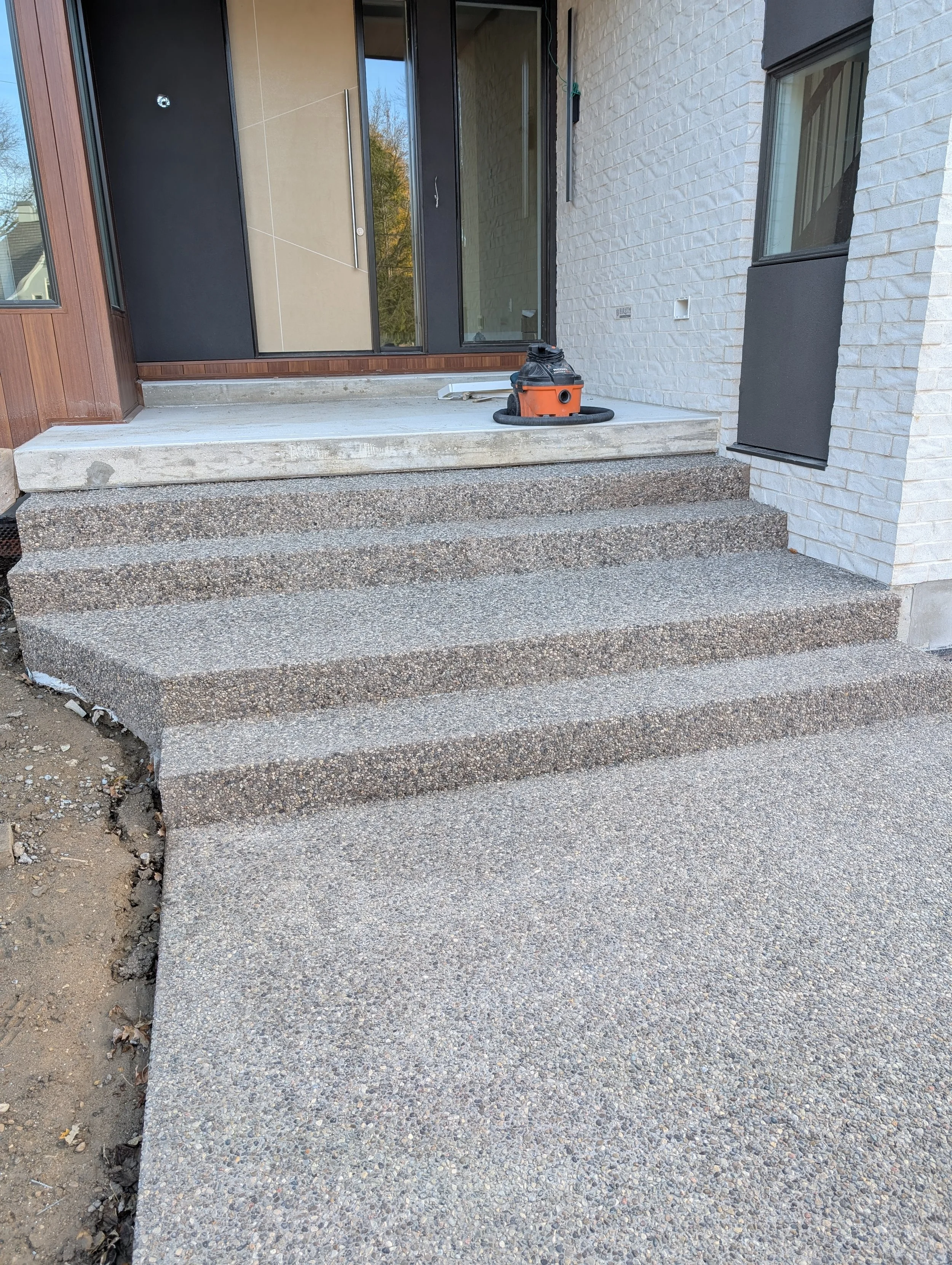 Brown rocky top heated concrete steps.jpg