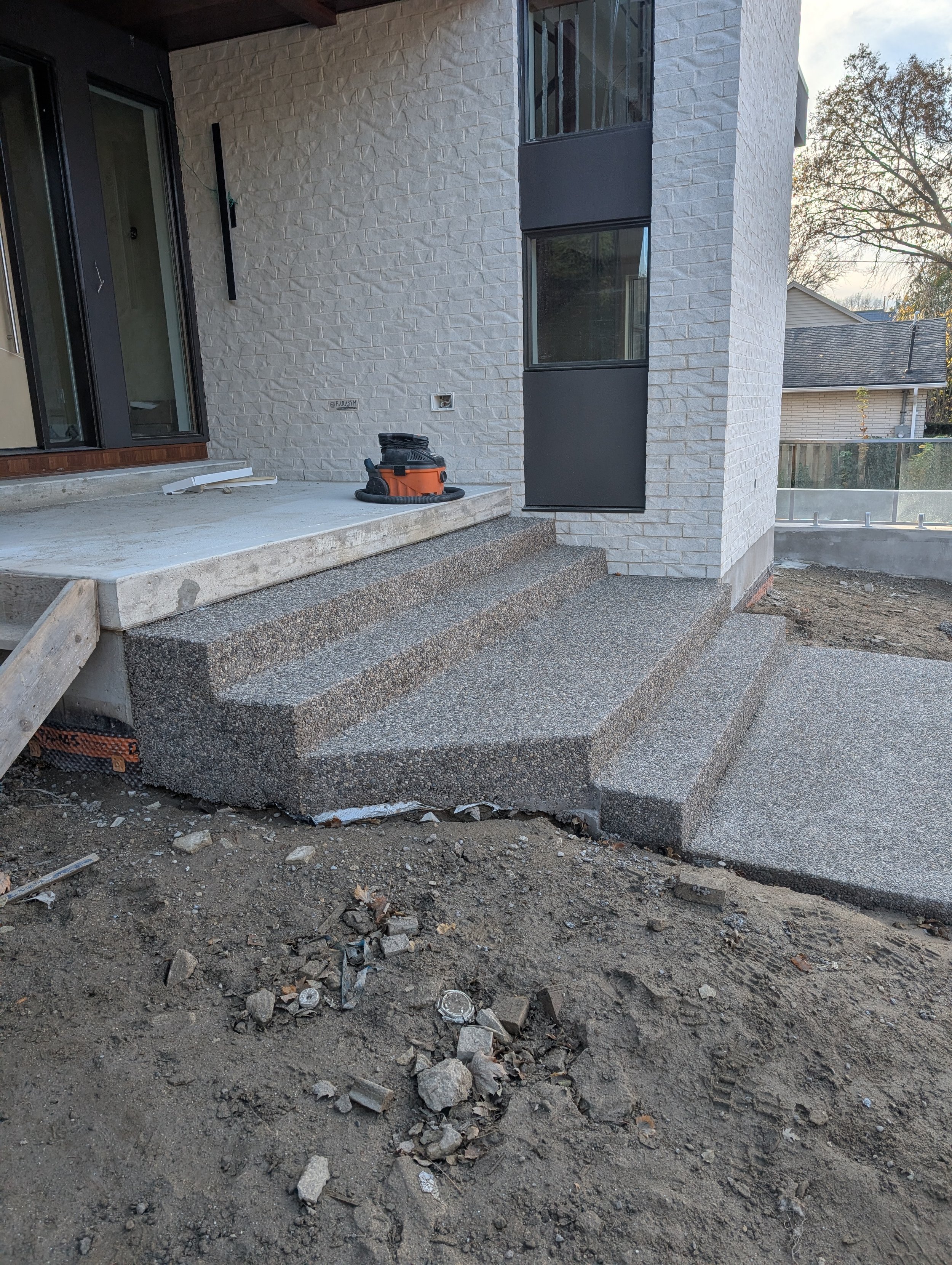 Brown rocky top heated concrete steps and sidewalk.jpg
