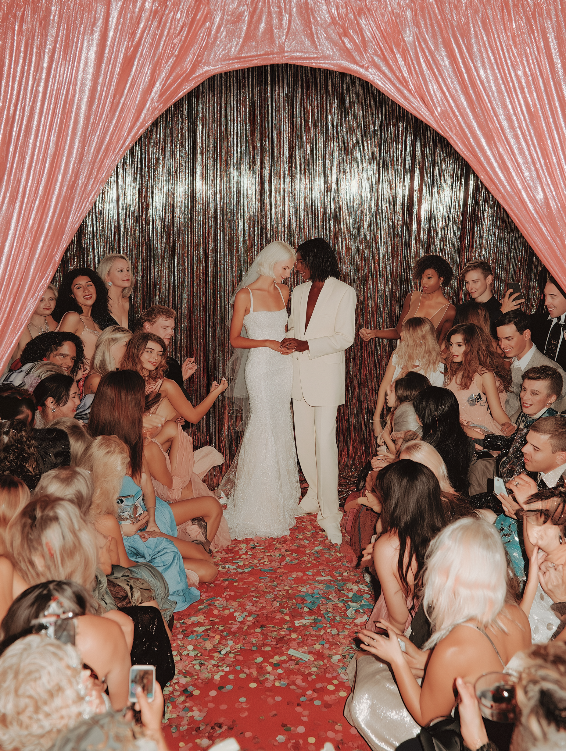 kvstudio_lesbian_couple_getting_married_with_pink_drapes_in_the_2e60409b-23a7-4934-832a-51718e080bd6.png