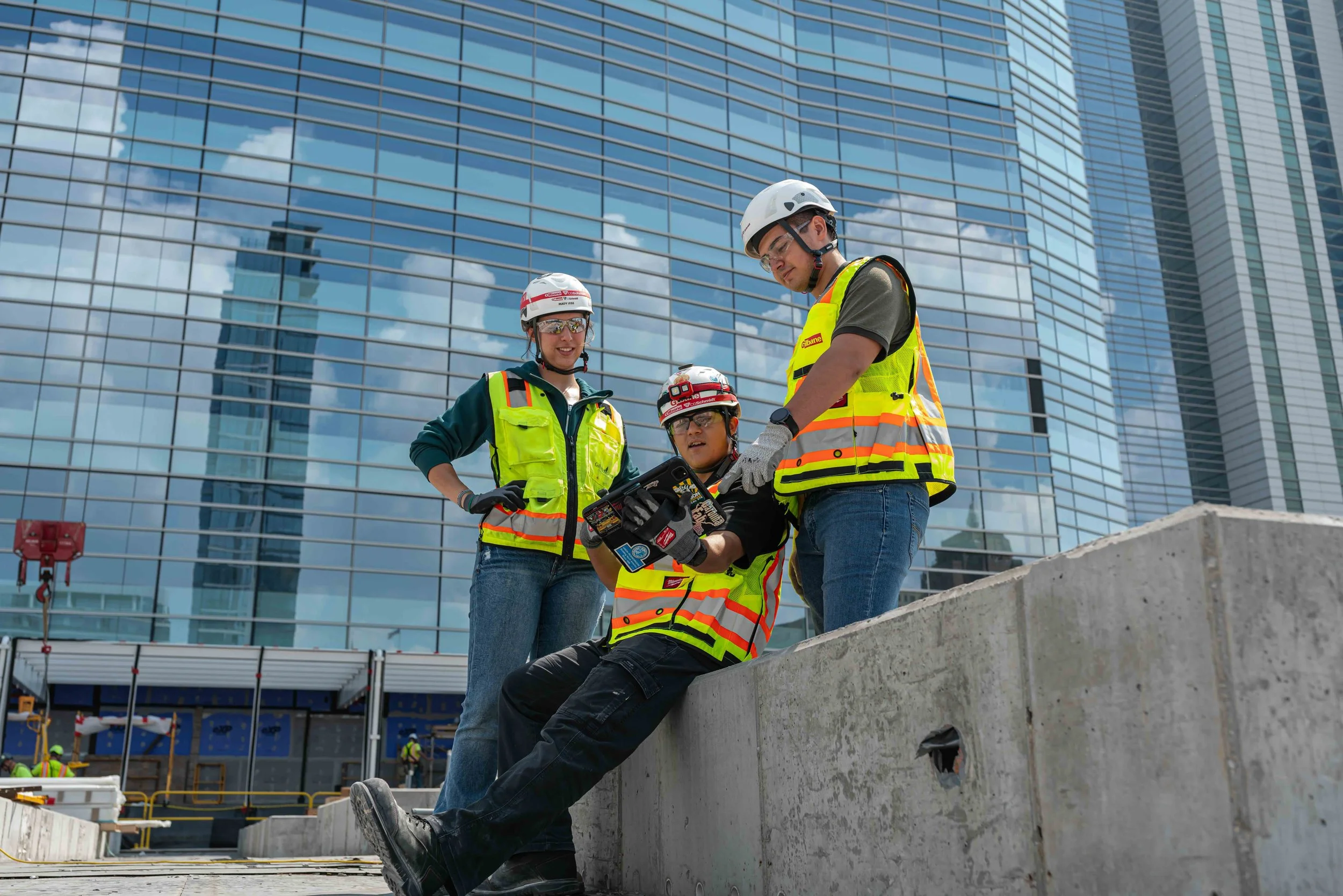 gilbane craft workers working together on a jobsite