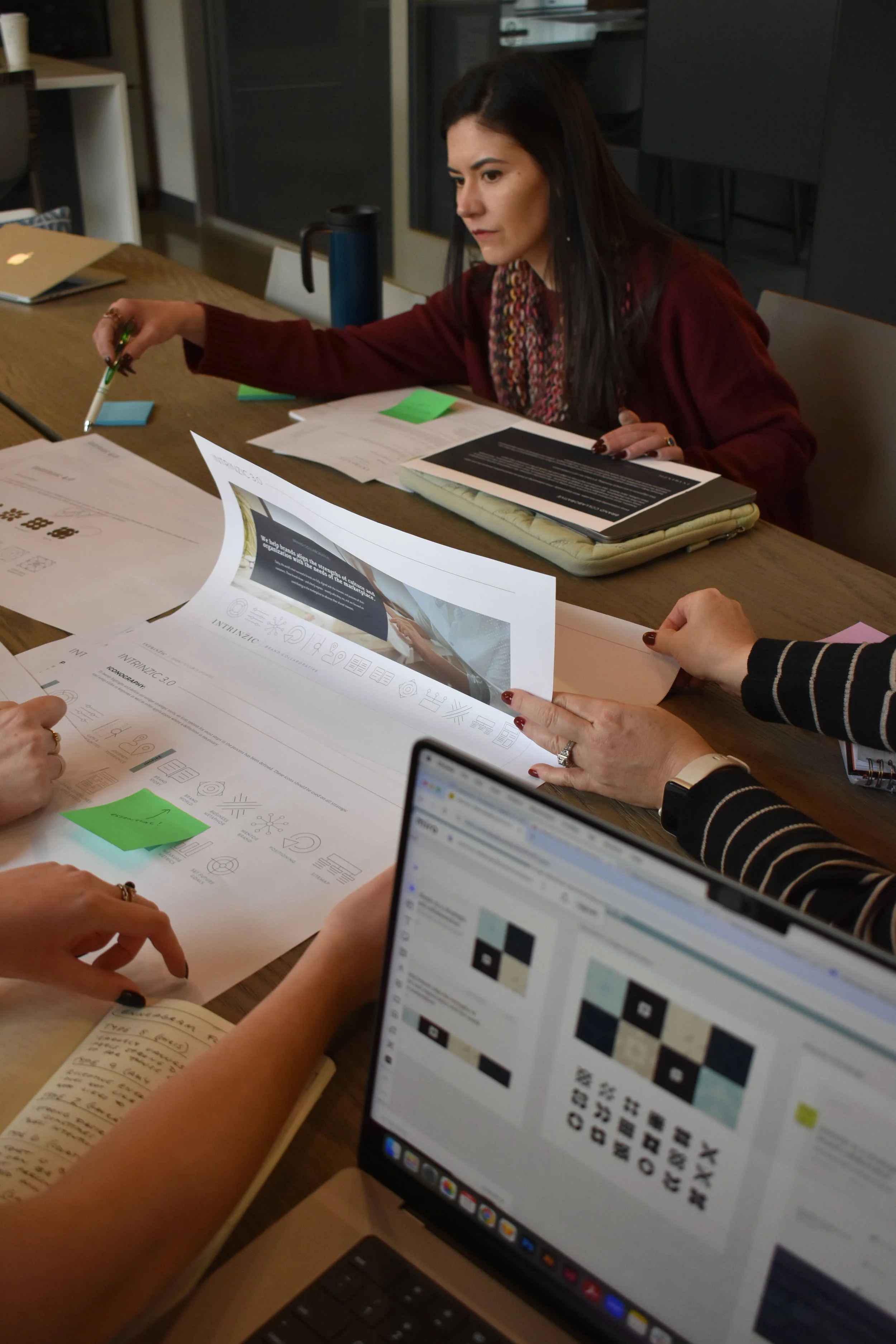 Intrinzic team collaborating on a project, close up shot