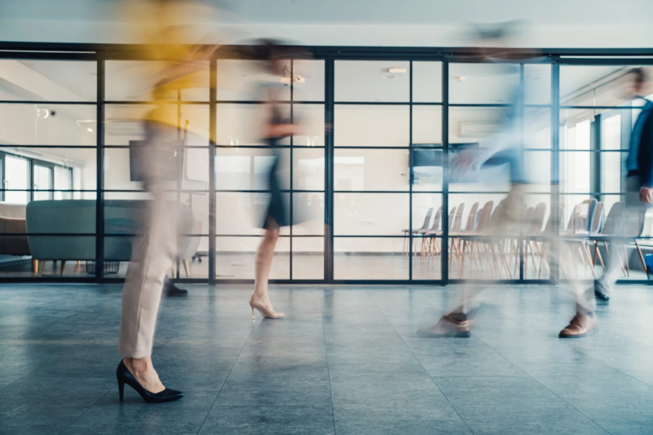 people walking by fast at an office