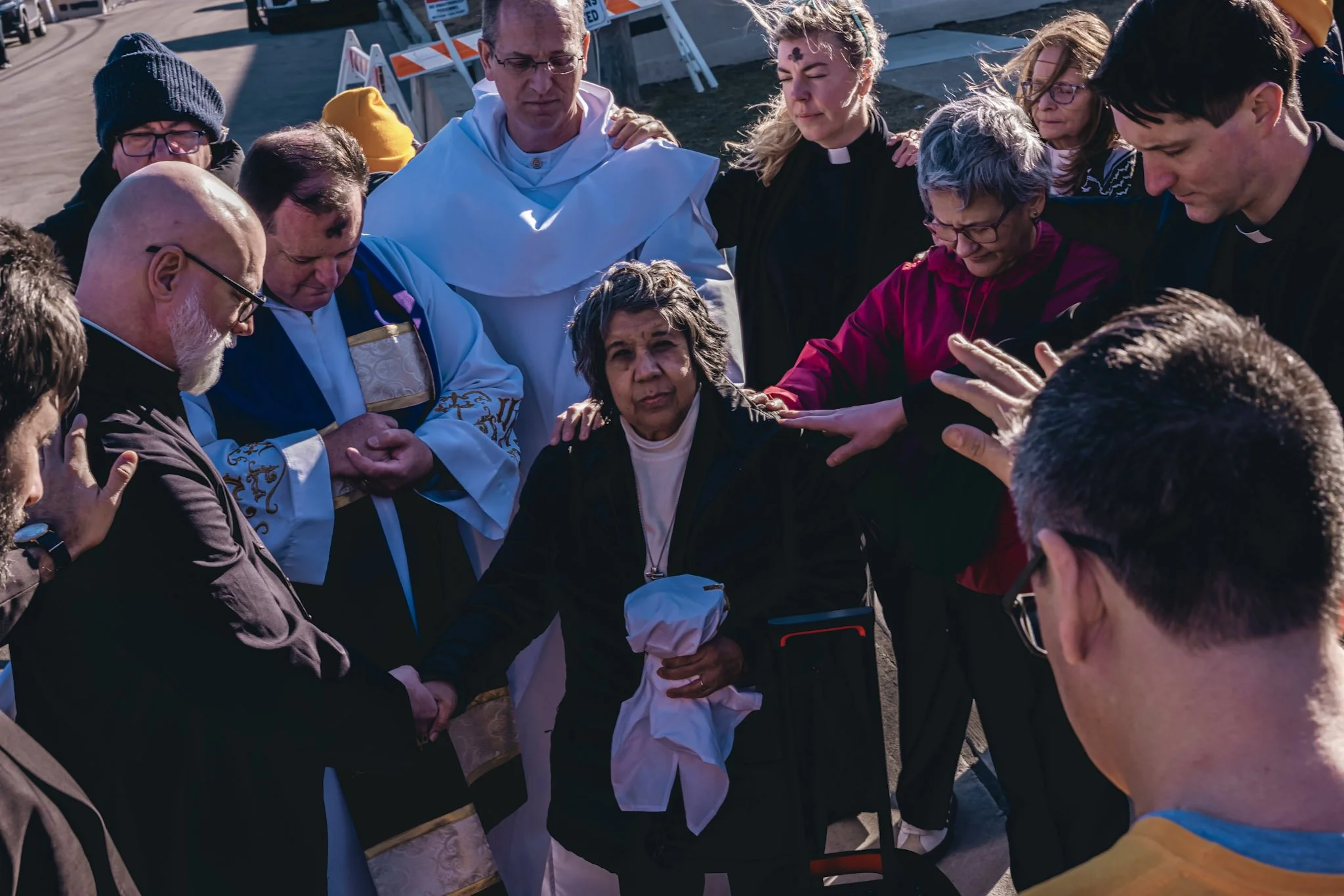 CSPL members pray over delegation before they enter Broadview ICE facility