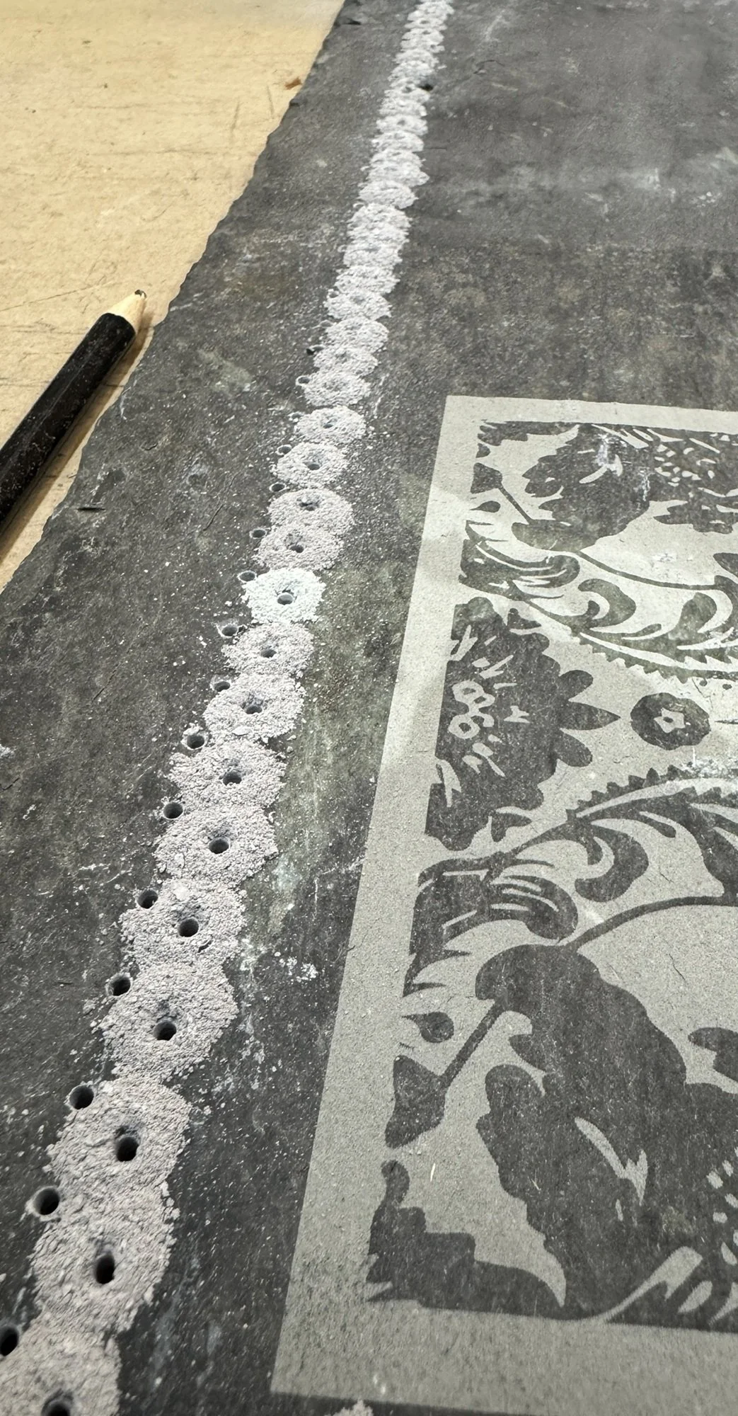 Etched slate with drilling.jpg
