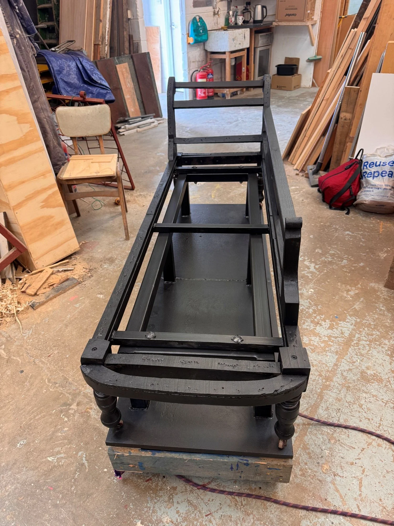 Chaise reinforced and painted black.JPG