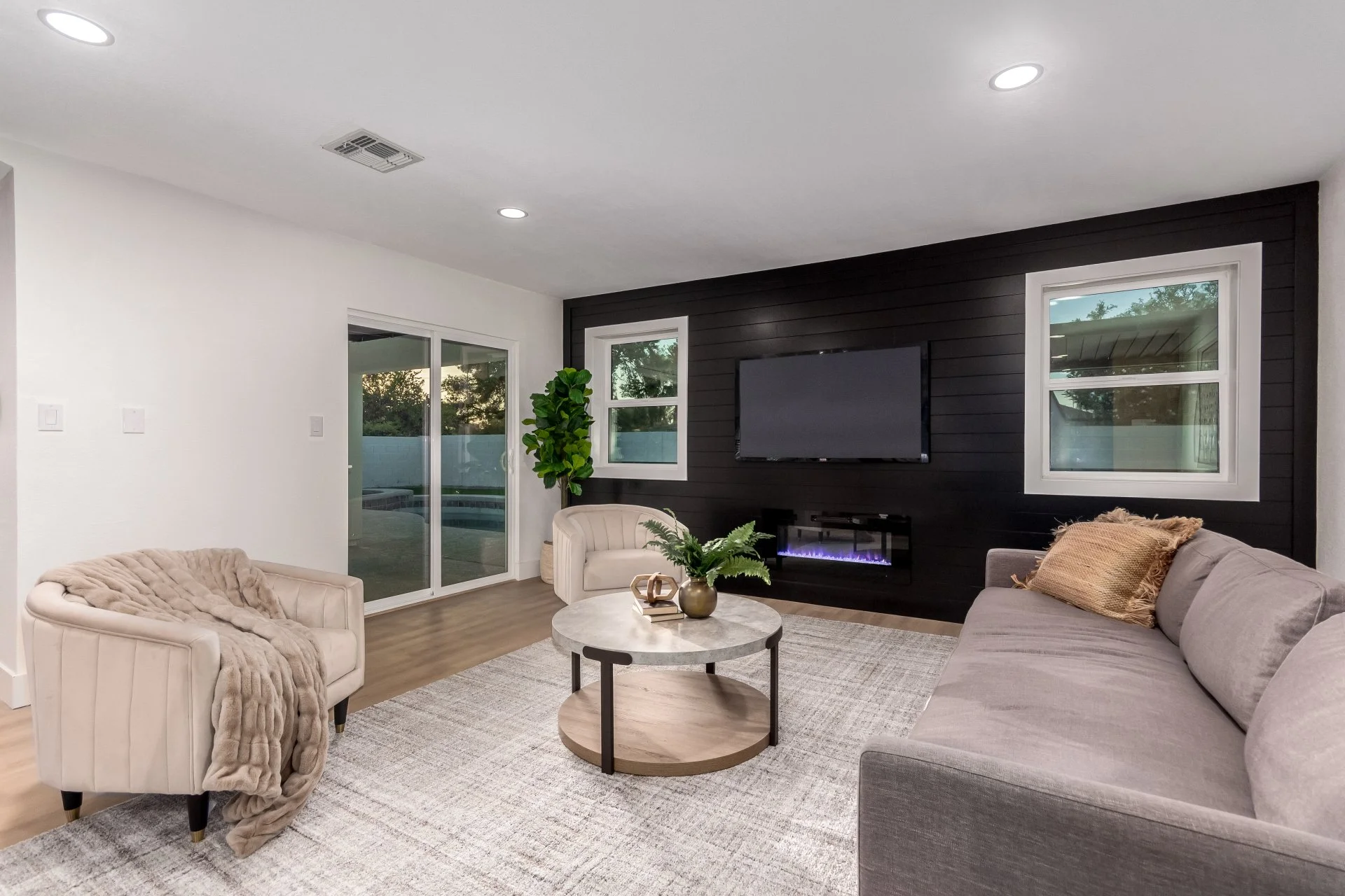 Media Room with Custom Wall with Fireplace and Windows