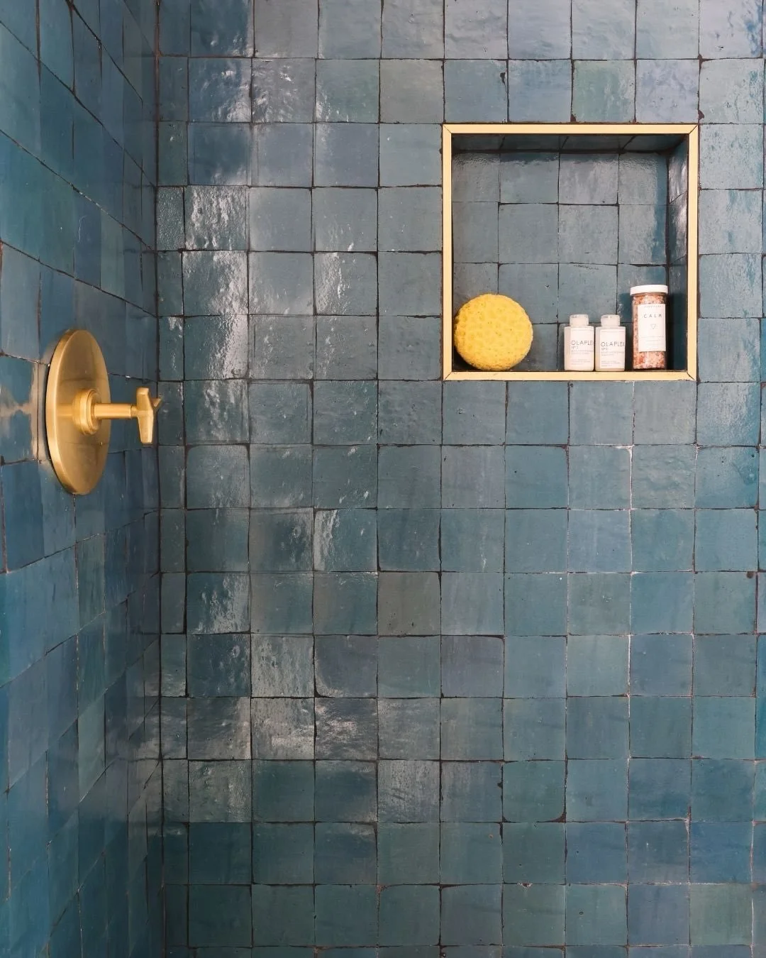 Still not over this zellige tile. 💙

The variation, the texture, the way it catches the light. Every tile is a little different, which gives the entire shower so much depth and character.

Paired with warm brass fixtures and crisp white finishes, it