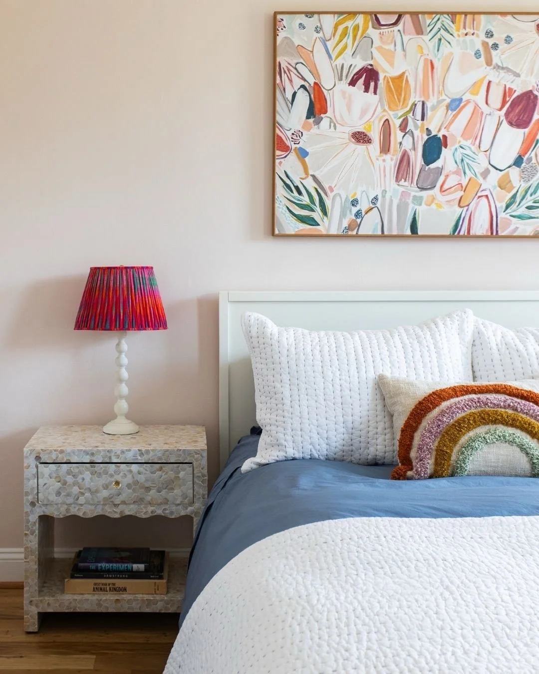 When we asked what color she wanted her room to be, the answer was simple: rainbow. 🌈

So we ran with it, just in a way that could grow with her. Color shows up everywhere from the rug and lampshade to the artwork and, of course, in the rainbow pill