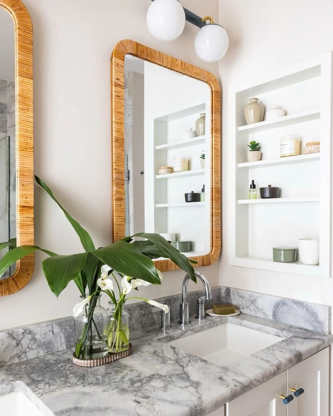 Our clients&rsquo; favorite place to travel as a family is the Ritz-Carlton in Grand Cayman, and they wanted to bring a little of that relaxed, tropical feel home to DC.

In the primary bathroom, that came through with rattan-wrapped mirrors, peacock