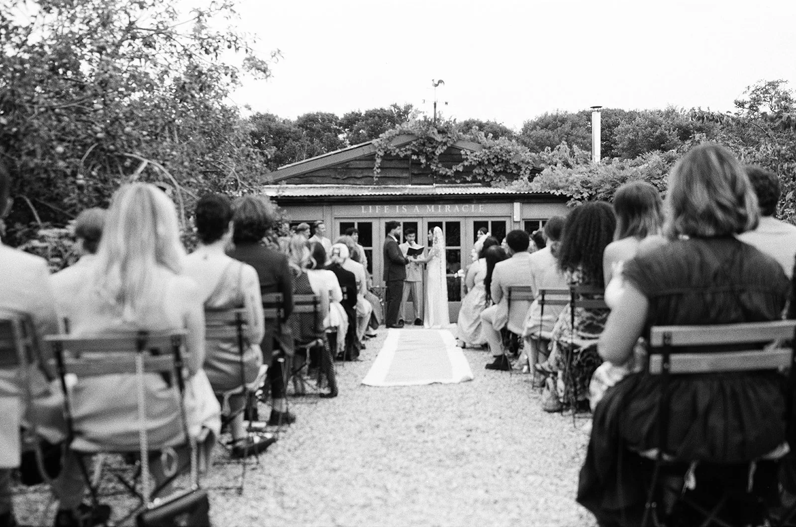 An outdoor wedding ceremony at Worton Kitchen Garden