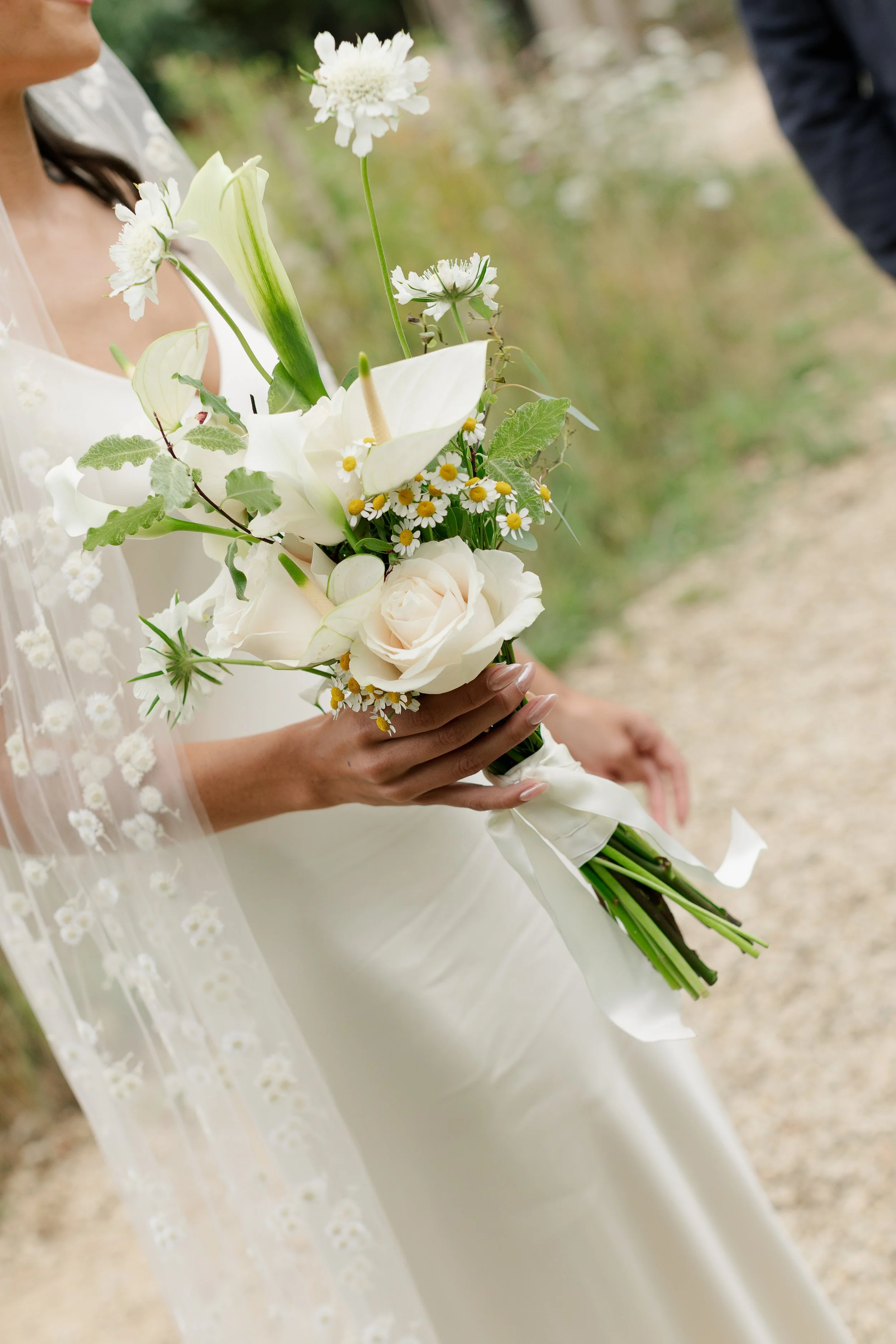 A wild floral bouquet for a bride at Worton Kitchen Garden